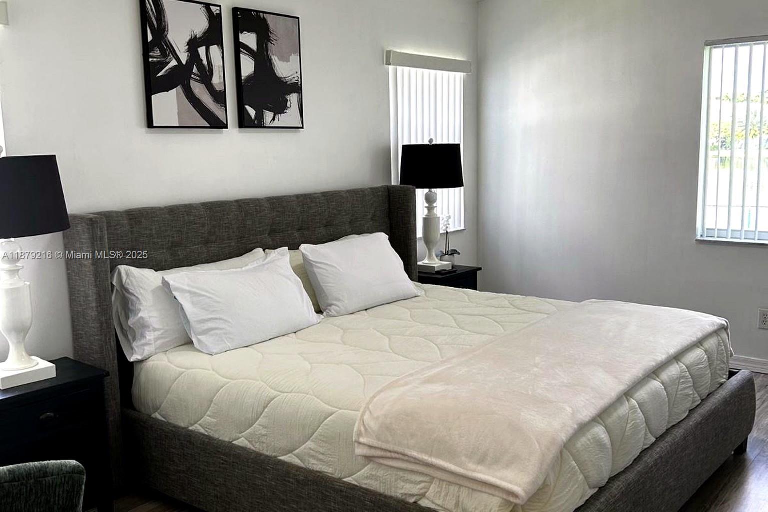 13221 Southwest 53rd Street Miramar, FL 33027 - Photo 17 of 24 a bedroom with a bed and a window