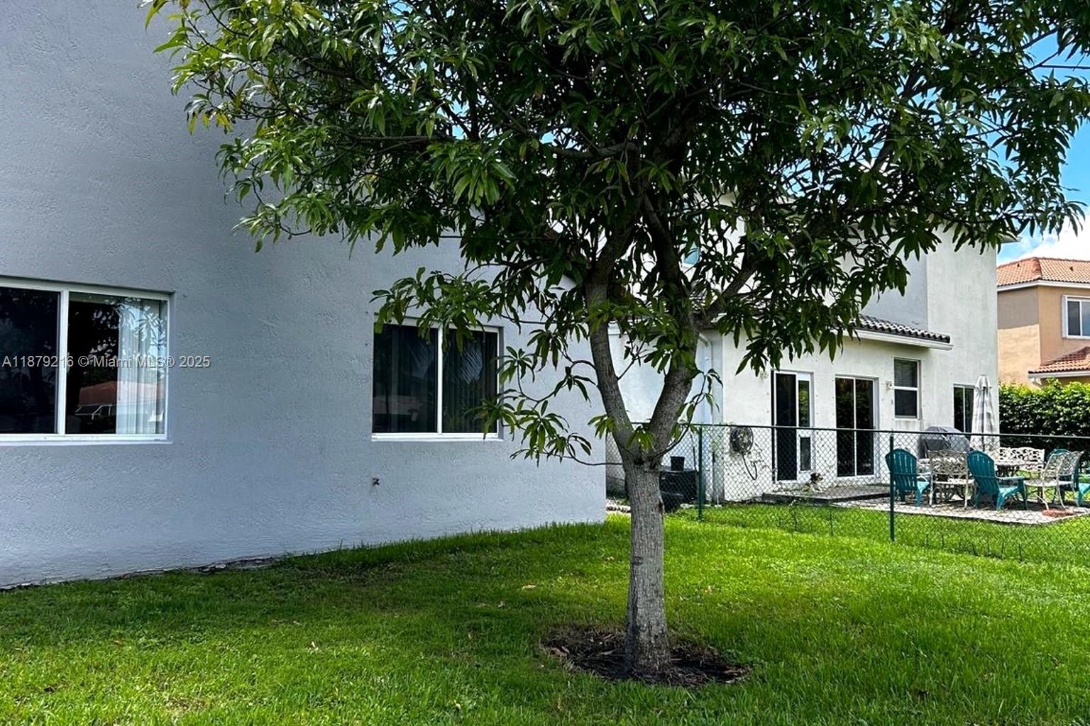 13221 Southwest 53rd Street Miramar, FL 33027 - Photo 2 of 24 a view of house with a yard