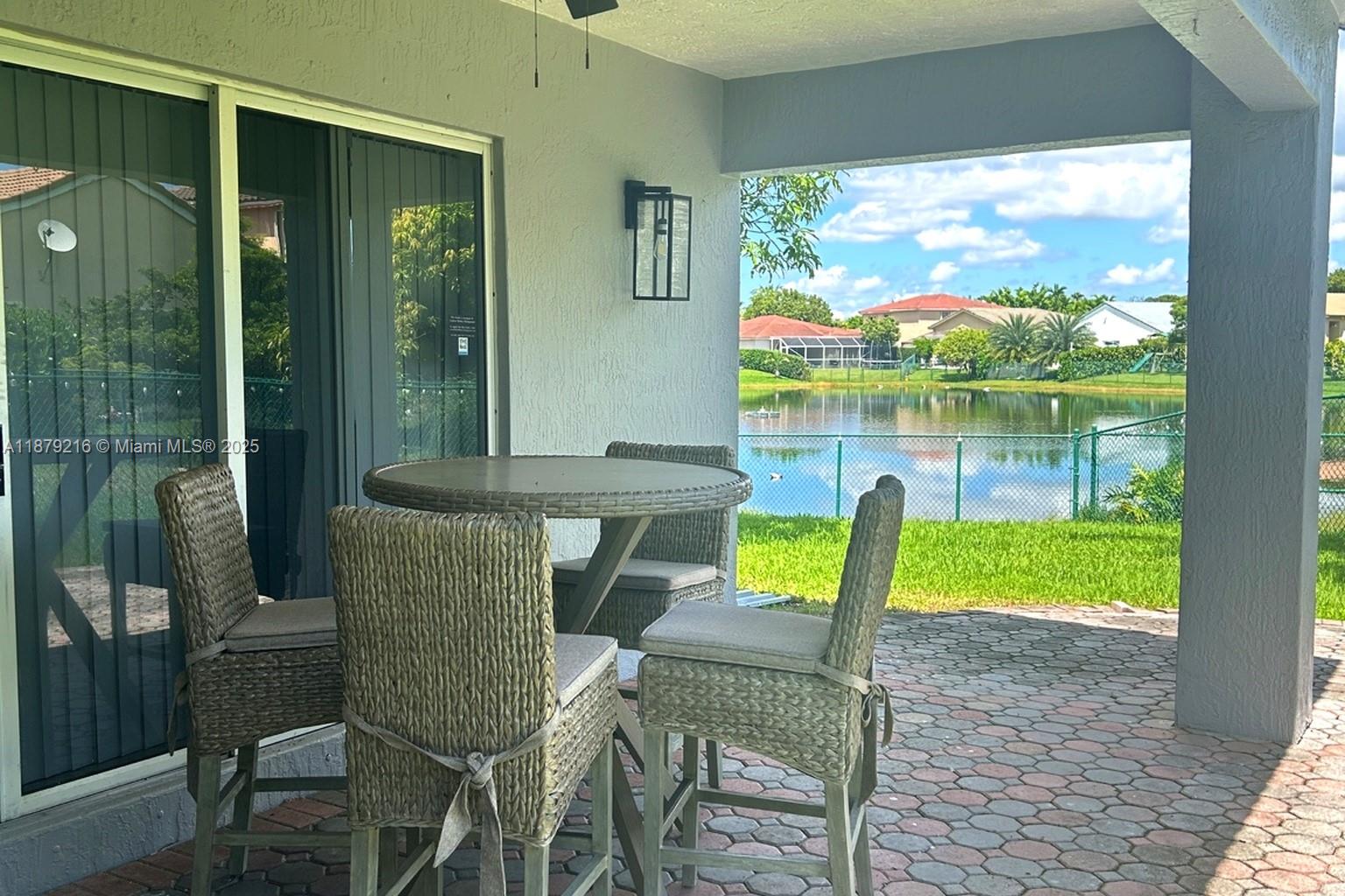 13221 Southwest 53rd Street Miramar, FL 33027 - Photo 5 of 24 a view of a porch with chairs and backyard