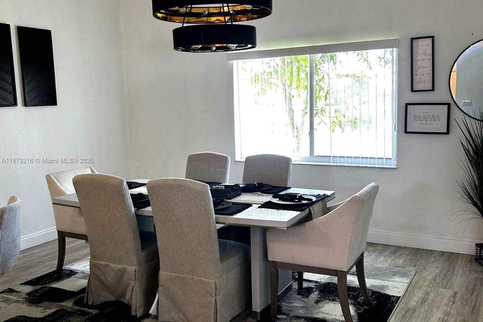 13221 Southwest 53rd Street Miramar, FL 33027 - Photo 8 of 24 a work place with furniture a flat screen tv and a window