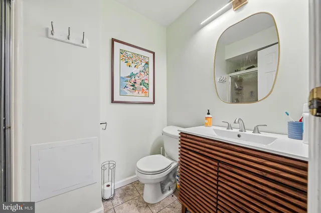 a bathroom with a glass shower door