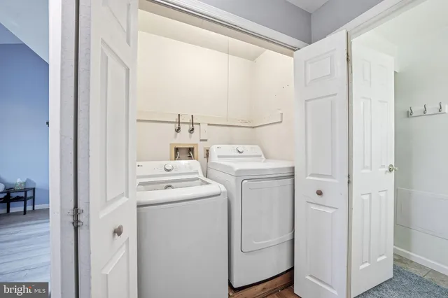 a picture of a room with a white wall and a large window