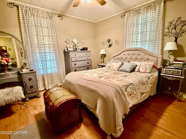 a bedroom with double bed and a window