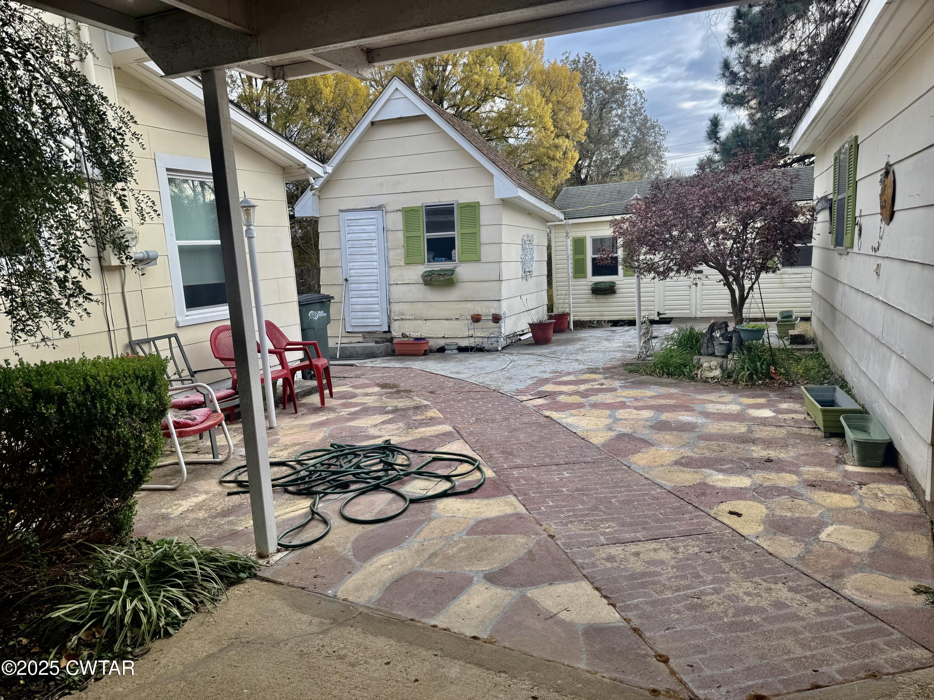 3121 Lantern Lane Union City, TN 38261 - Photo 16 of 19 a view of a chairs and table in backyard