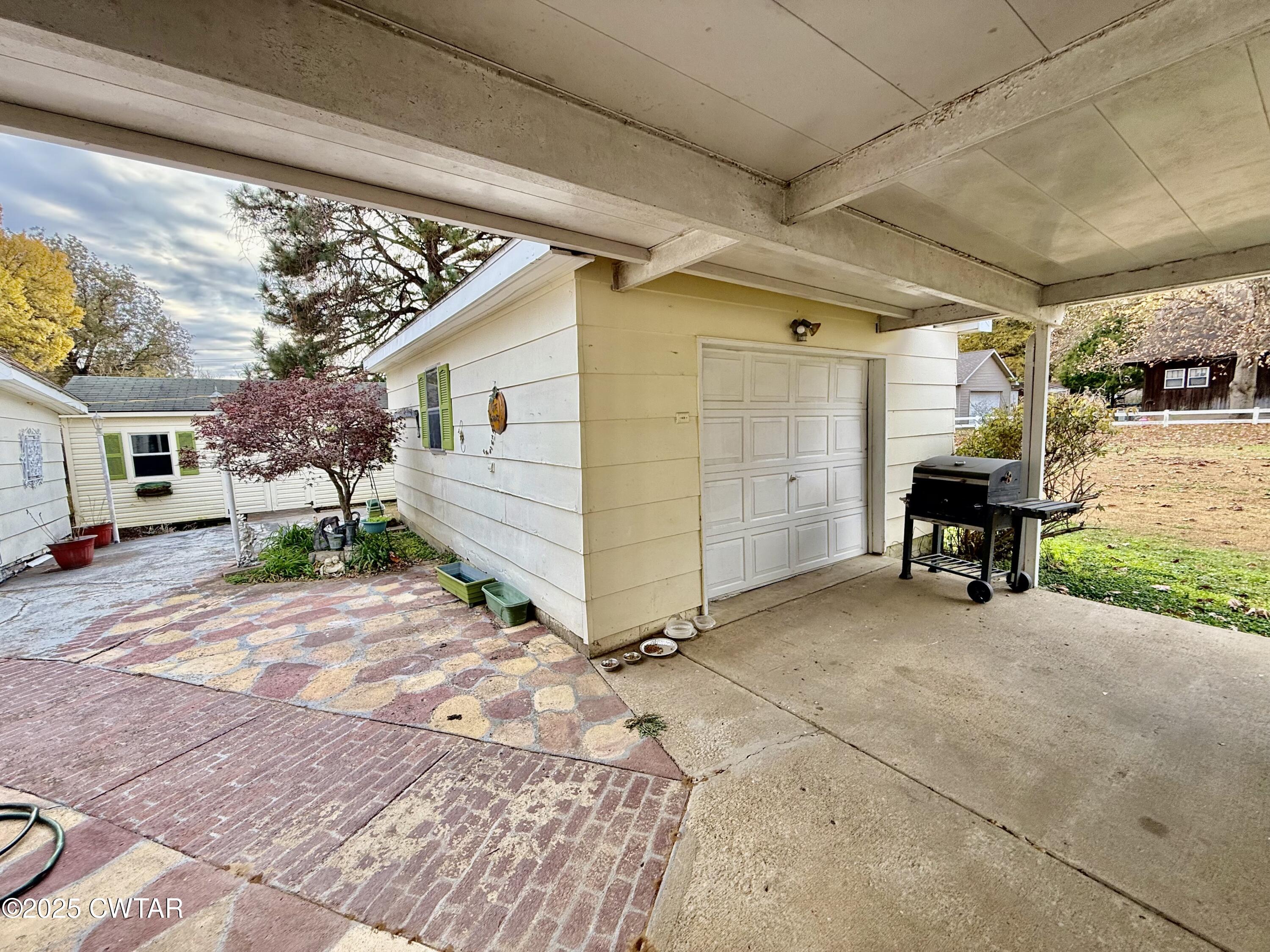 3121 Lantern Lane Union City, TN 38261 - Photo 19 of 19 a view of a porch with furniture and a yard