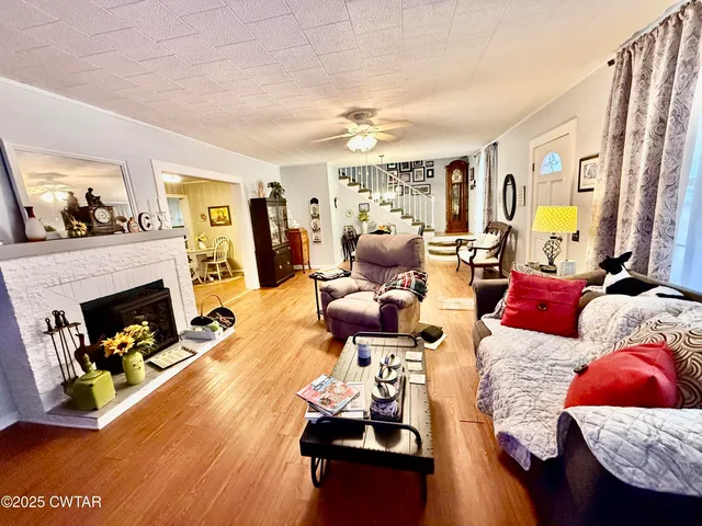 a living room with furniture and a fireplace