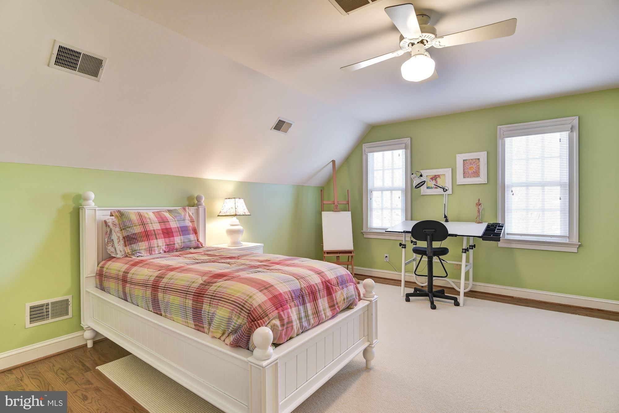 10908 Cripplegate Road Potomac, MD 20854 - Photo 22 of 29 a bedroom with a bed and a table