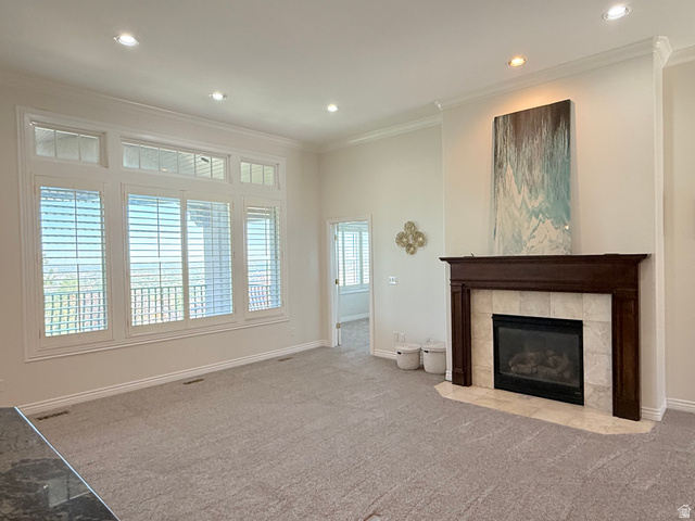 1562 Fairway Ridge Road Draper, UT 84020 - Photo 8 of 60 Spacious living area featuring a central fireplace with a dark wood mantel and light-toned tile surround