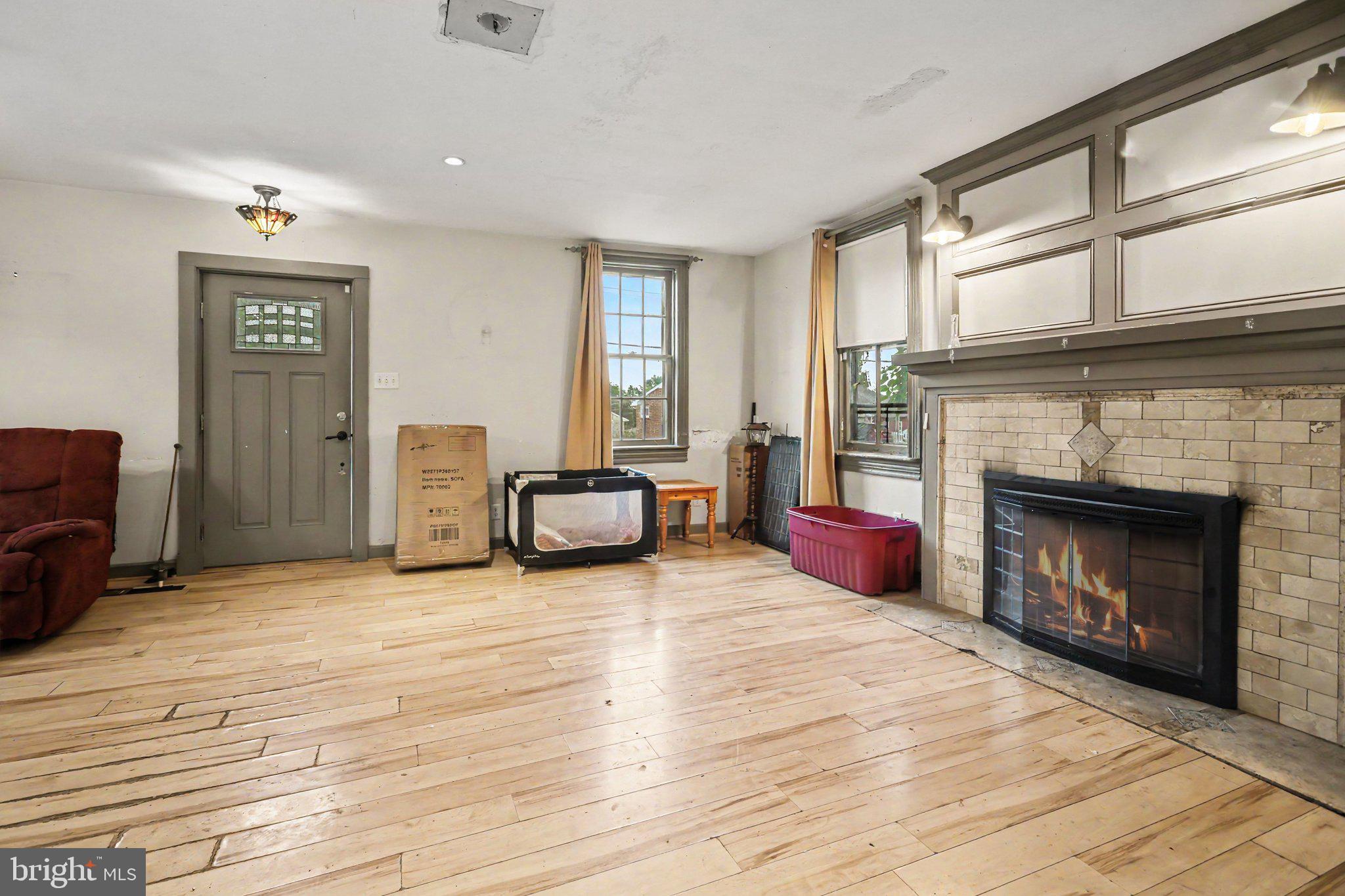 61 Mayfield Street Dover, PA 17315 - Photo 11 of 26 Spacious room with charming fireplace.