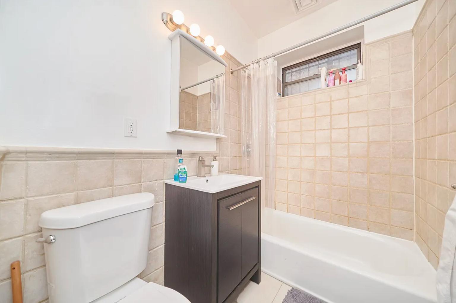 459 Sterling Place, Unit 3 Brooklyn, NY 11238 - Photo 5 of 7 a bathroom with a sink a toilet and shower