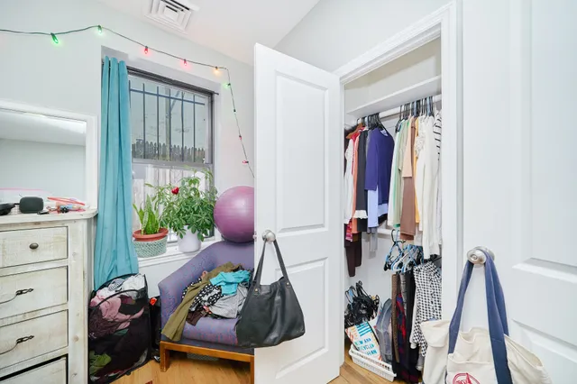 a view of a closet with storage