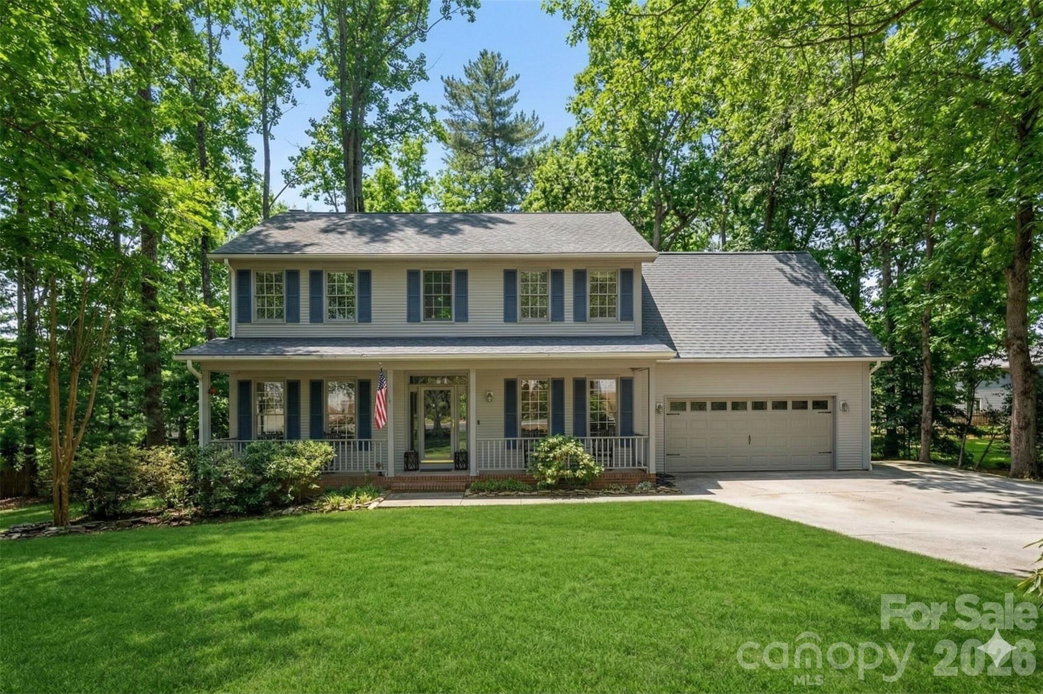 242 Windsor Forest Circle Fletcher, NC 28732 - Photo 1 of 43 a front view of a house with garden