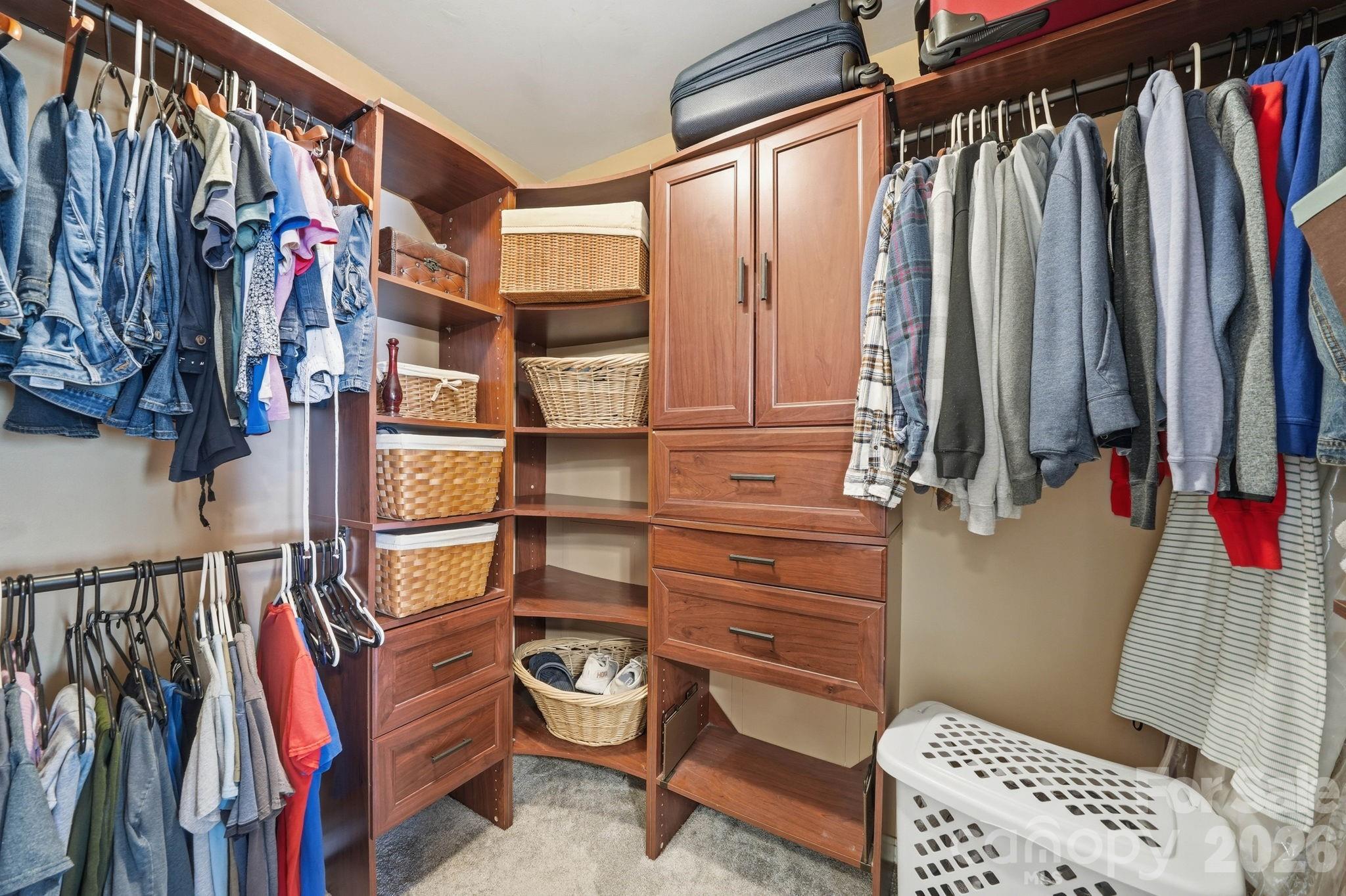242 Windsor Forest Circle Fletcher, NC 28732 - Photo 27 of 43 a view of walk in closet with clothes and shoes