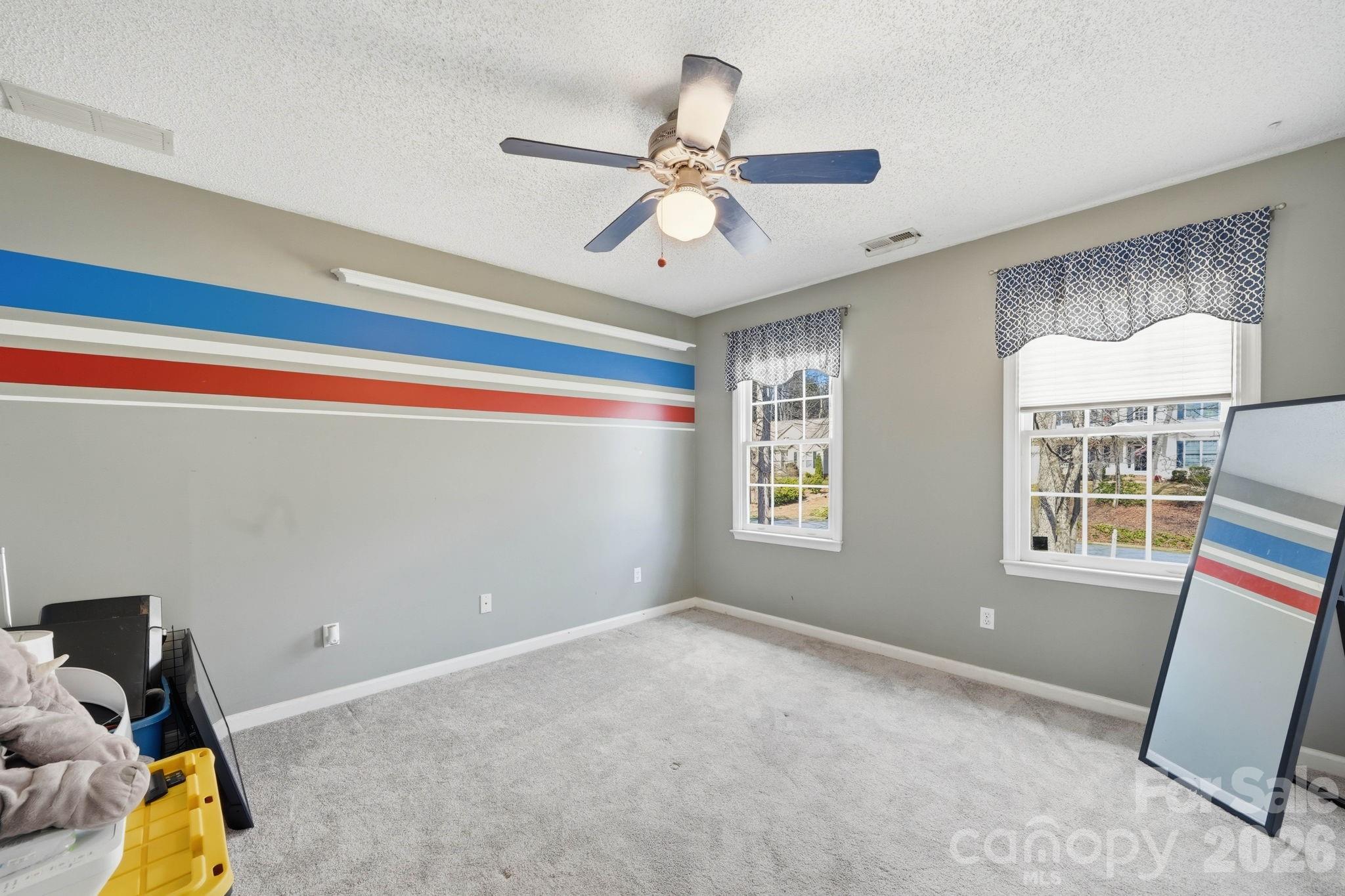 242 Windsor Forest Circle Fletcher, NC 28732 - Photo 30 of 43 a view of room with window and ceiling fan
