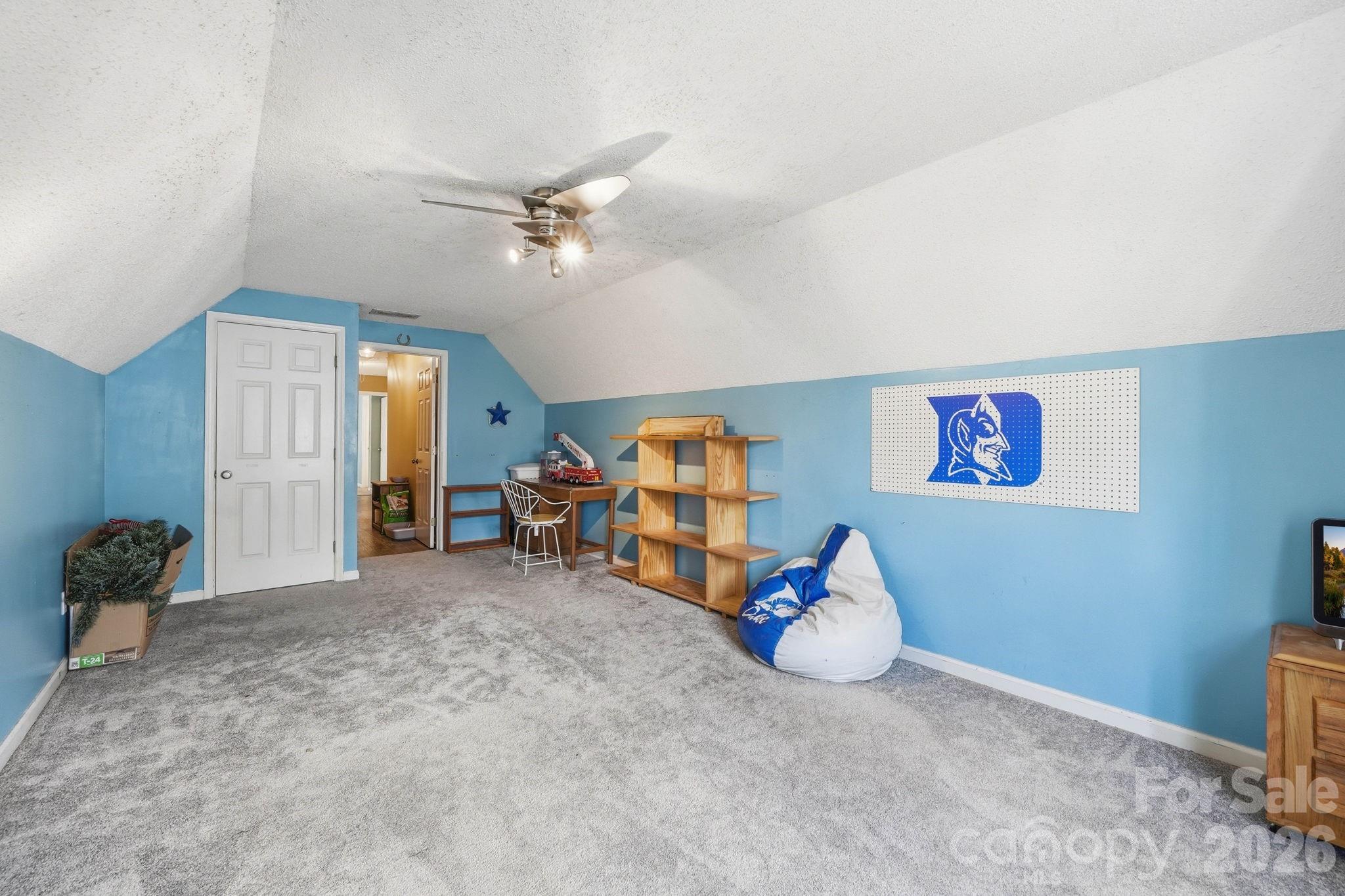 242 Windsor Forest Circle Fletcher, NC 28732 - Photo 32 of 43 a view of a room with toys and a ceiling fan