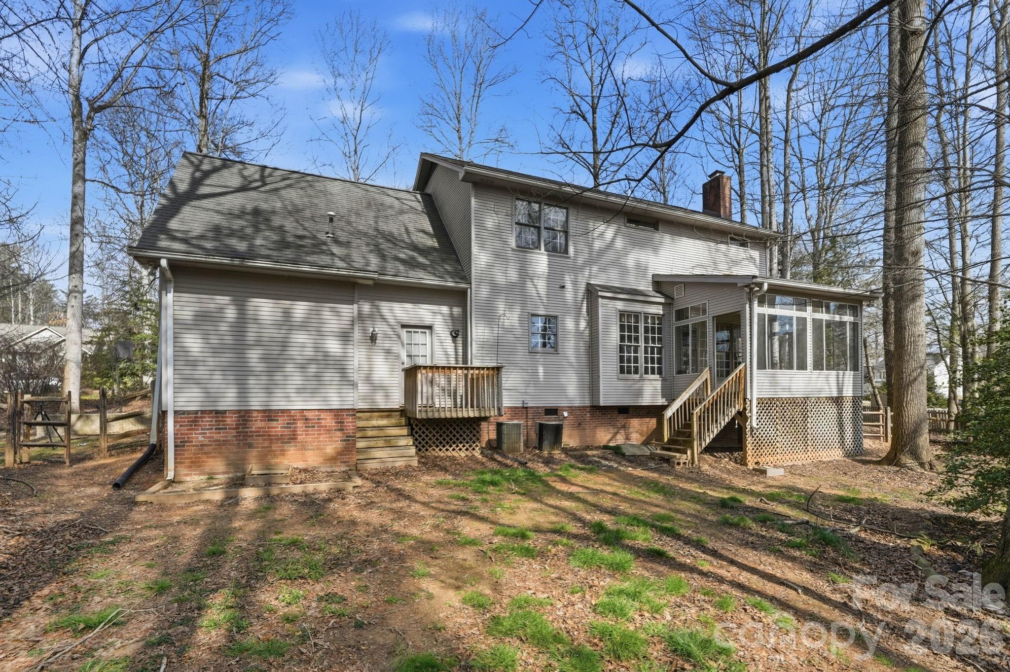 242 Windsor Forest Circle Fletcher, NC 28732 - Photo 34 of 43 a view of a house with backyard and a area