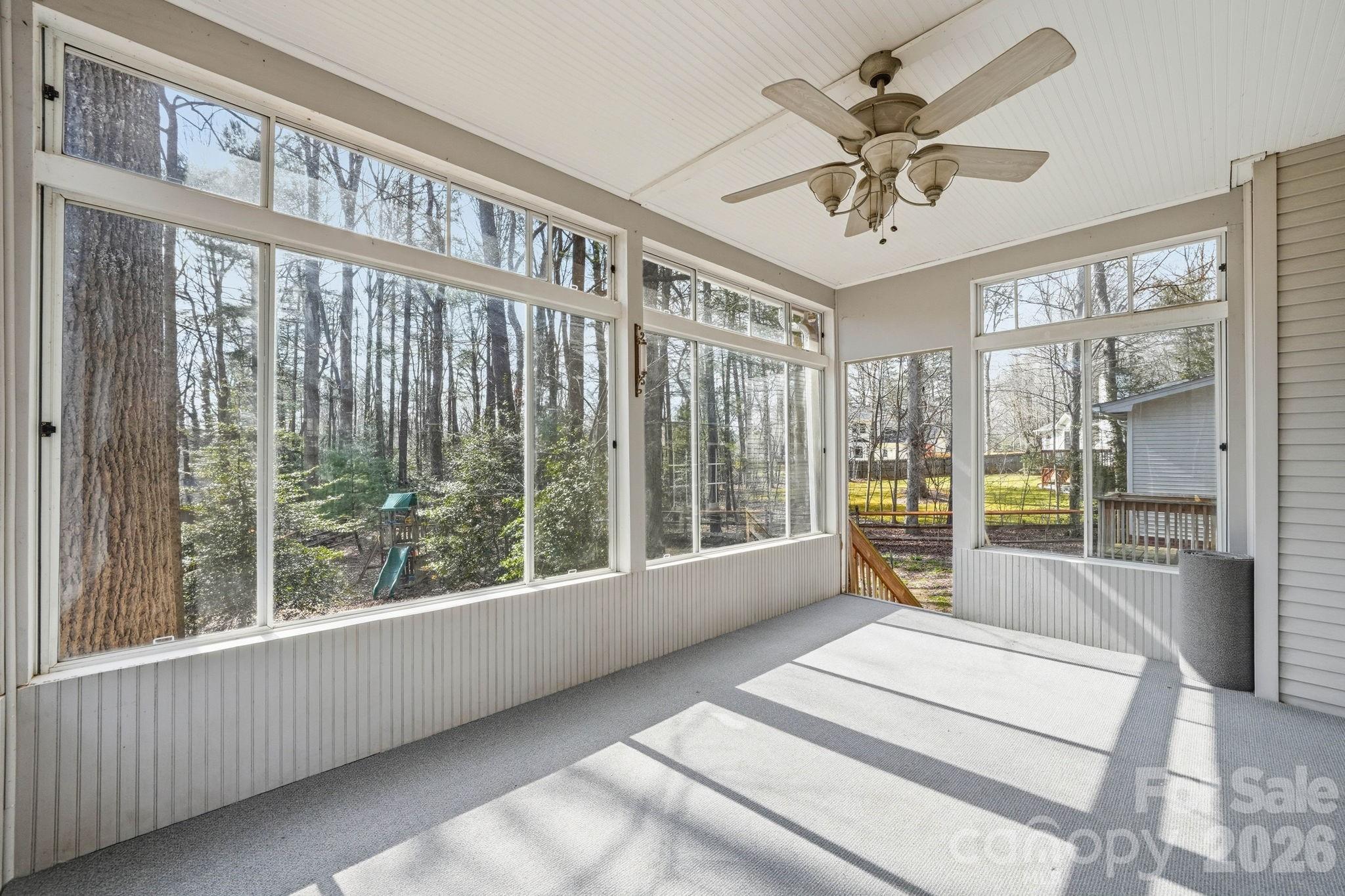 242 Windsor Forest Circle Fletcher, NC 28732 - Photo 36 of 43 a living room with furniture and a large window