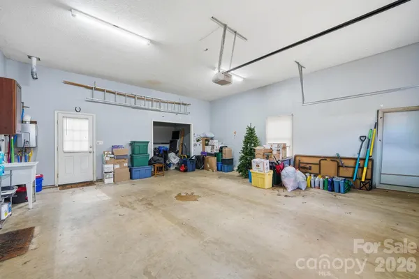 a view of a garage with toys and a tv