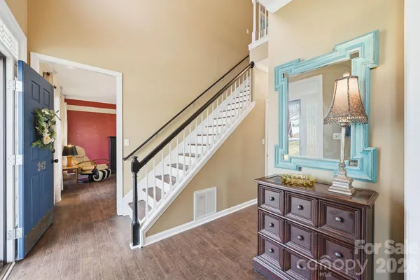 a view of an entryway with hardwood floor and interior
