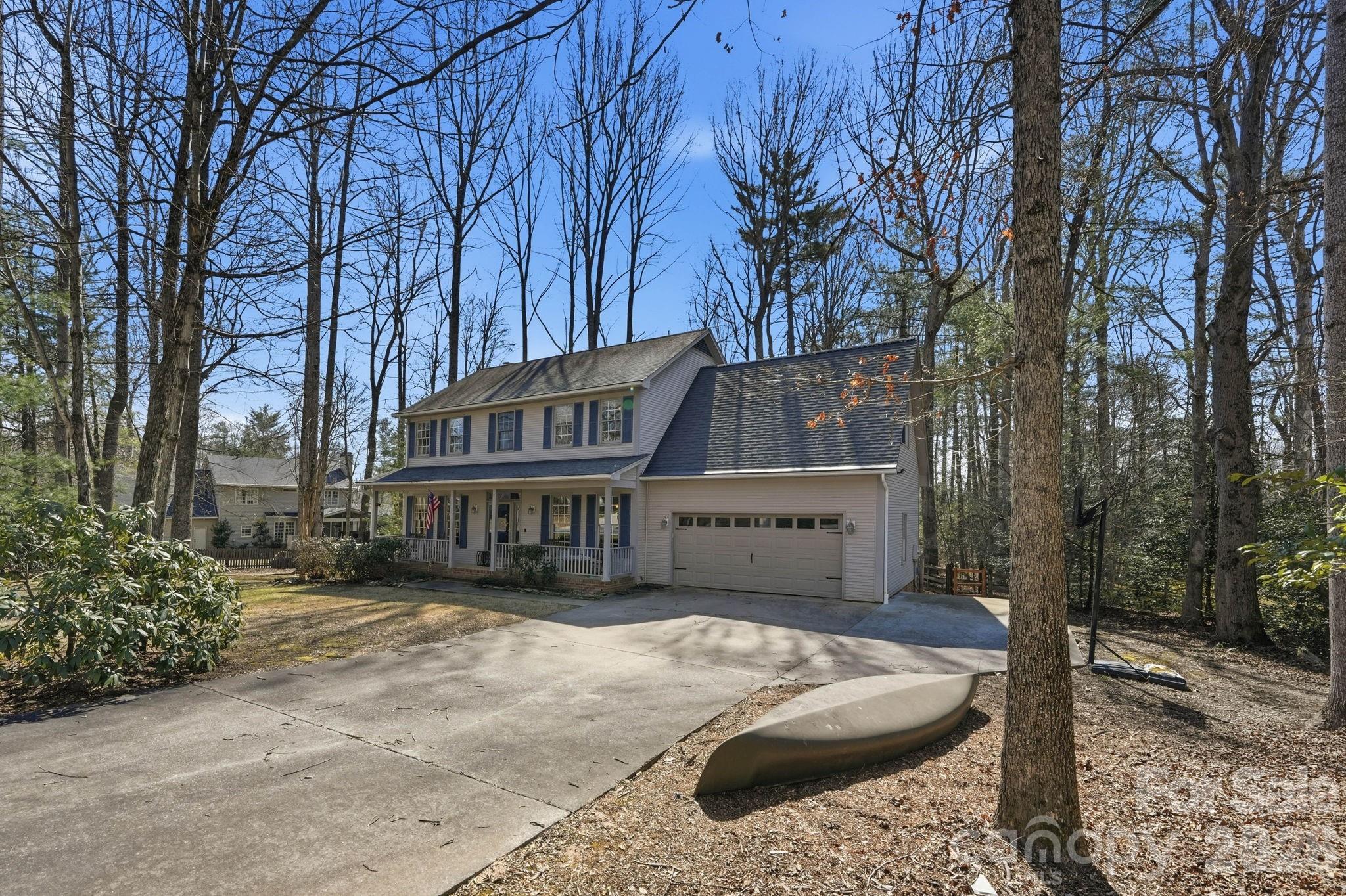 242 Windsor Forest Circle Fletcher, NC 28732 - Photo 42 of 43 a view of a house with a yard covered with snow in front of house