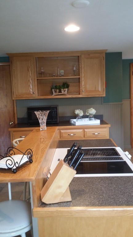 2 Boivin Avenue Ware, MA 01082 - Photo 11 of 21 a kitchen with a stove a sink and a white cabinets