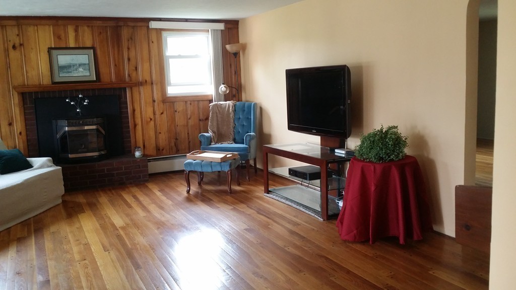 2 Boivin Avenue Ware, MA 01082 - Photo 14 of 21 a living room with furniture a flat screen tv and a wooden floor