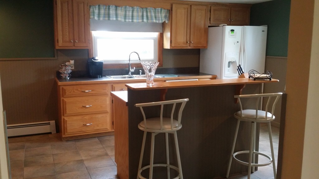 2 Boivin Avenue Ware, MA 01082 - Photo 9 of 21 a kitchen with a sink cabinets and a refrigerator
