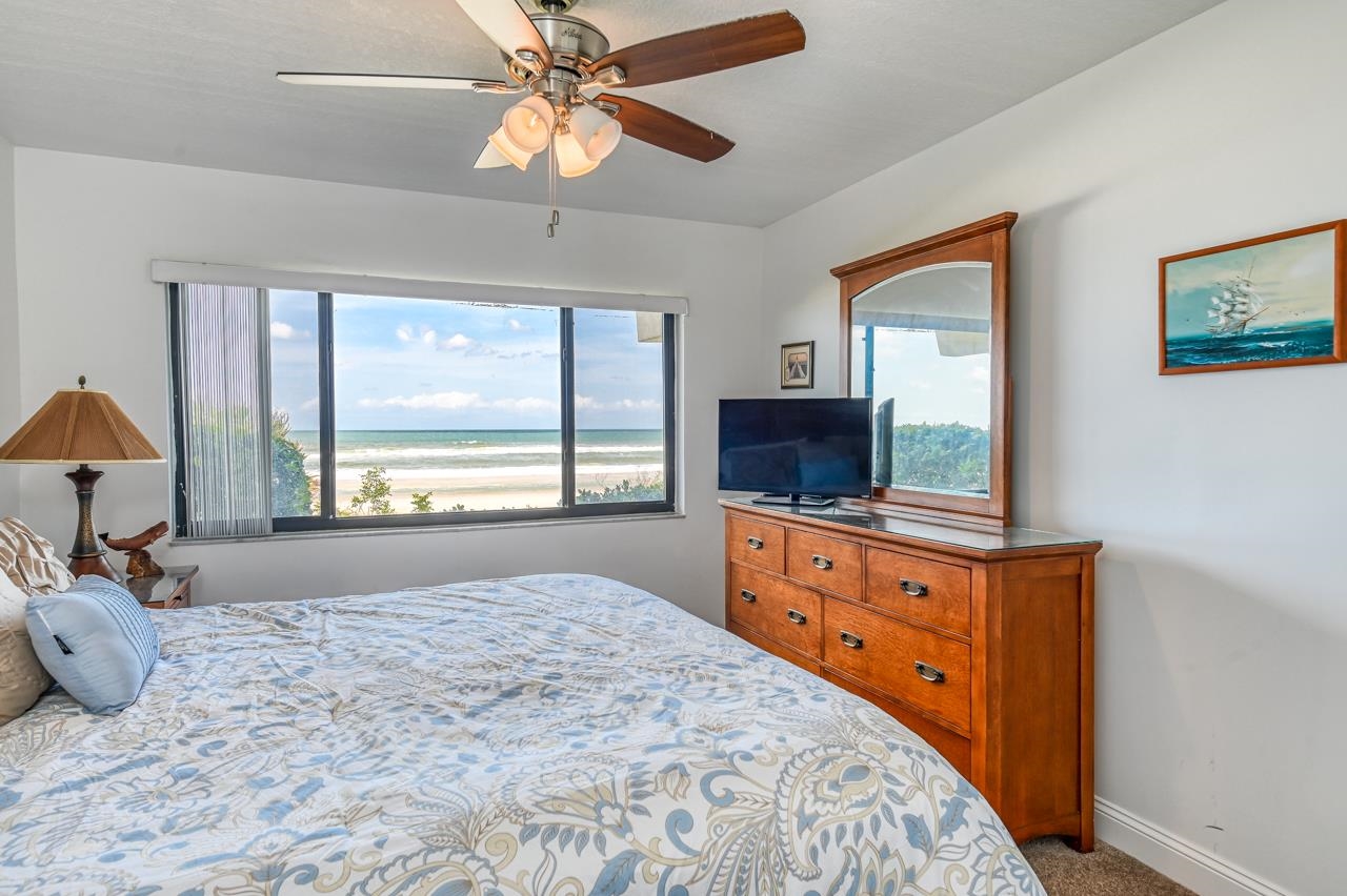 8550 A1A South, Unit 261 St. Augustine, FL 32080 - Photo 17 of 23 a bedroom with a bed and a flat screen tv