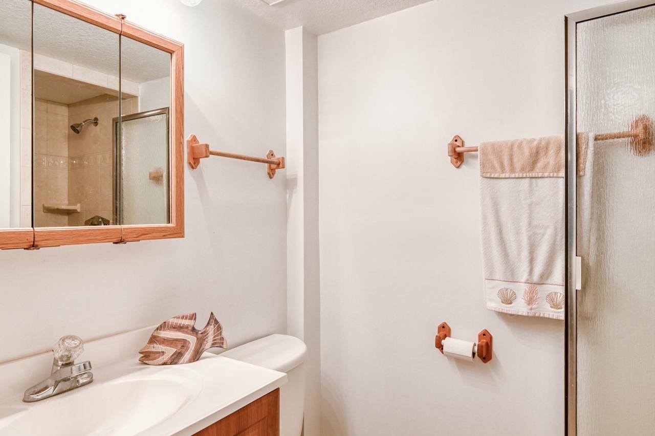 8550 A1A South, Unit 261 St. Augustine, FL 32080 - Photo 19 of 23 a bathroom with a sink and a mirror