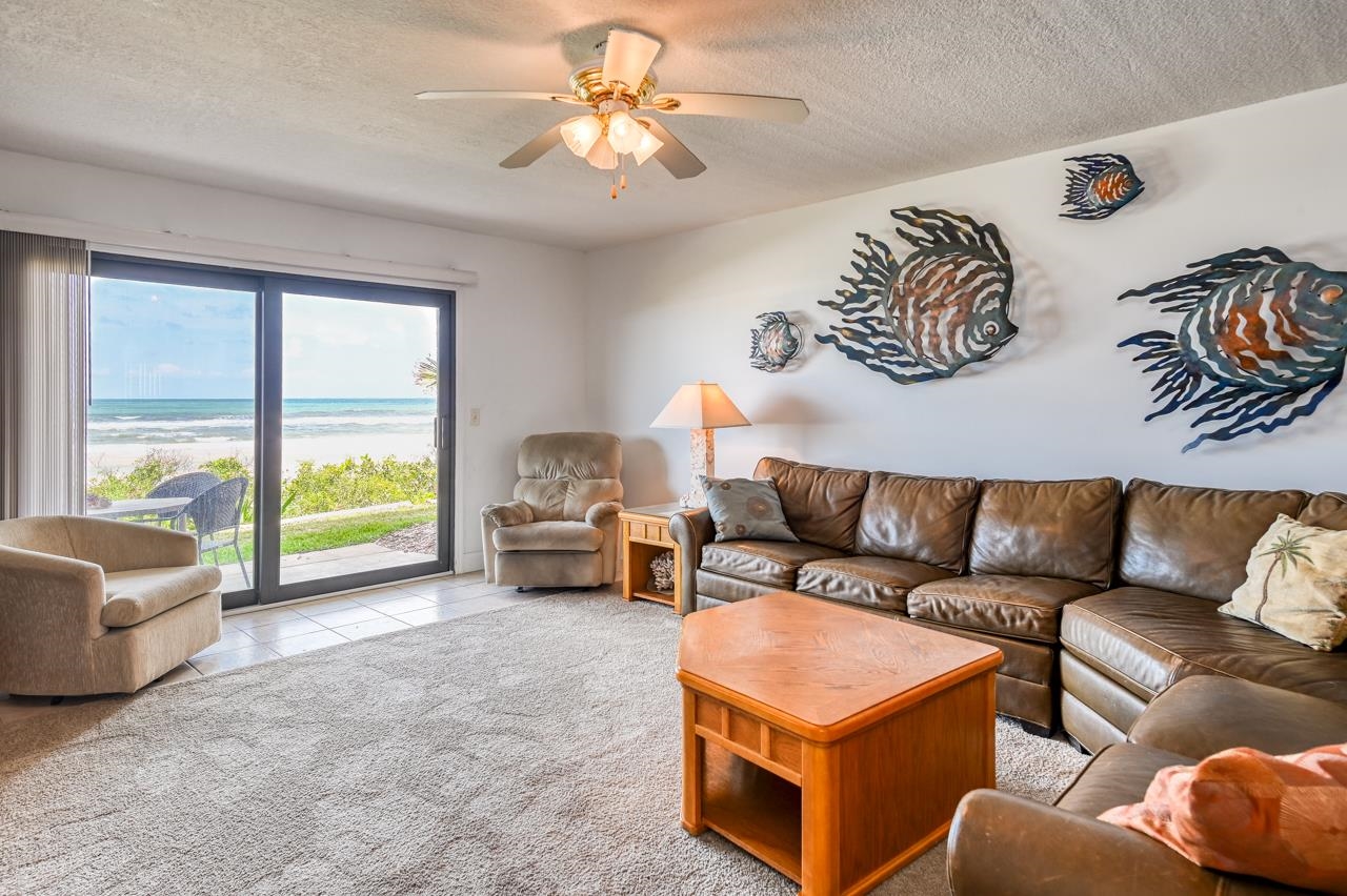 8550 A1A South, Unit 261 St. Augustine, FL 32080 - Photo 10 of 23 a living room with furniture and a large window