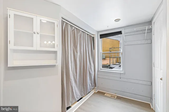 a bathroom with a toilet and a shower