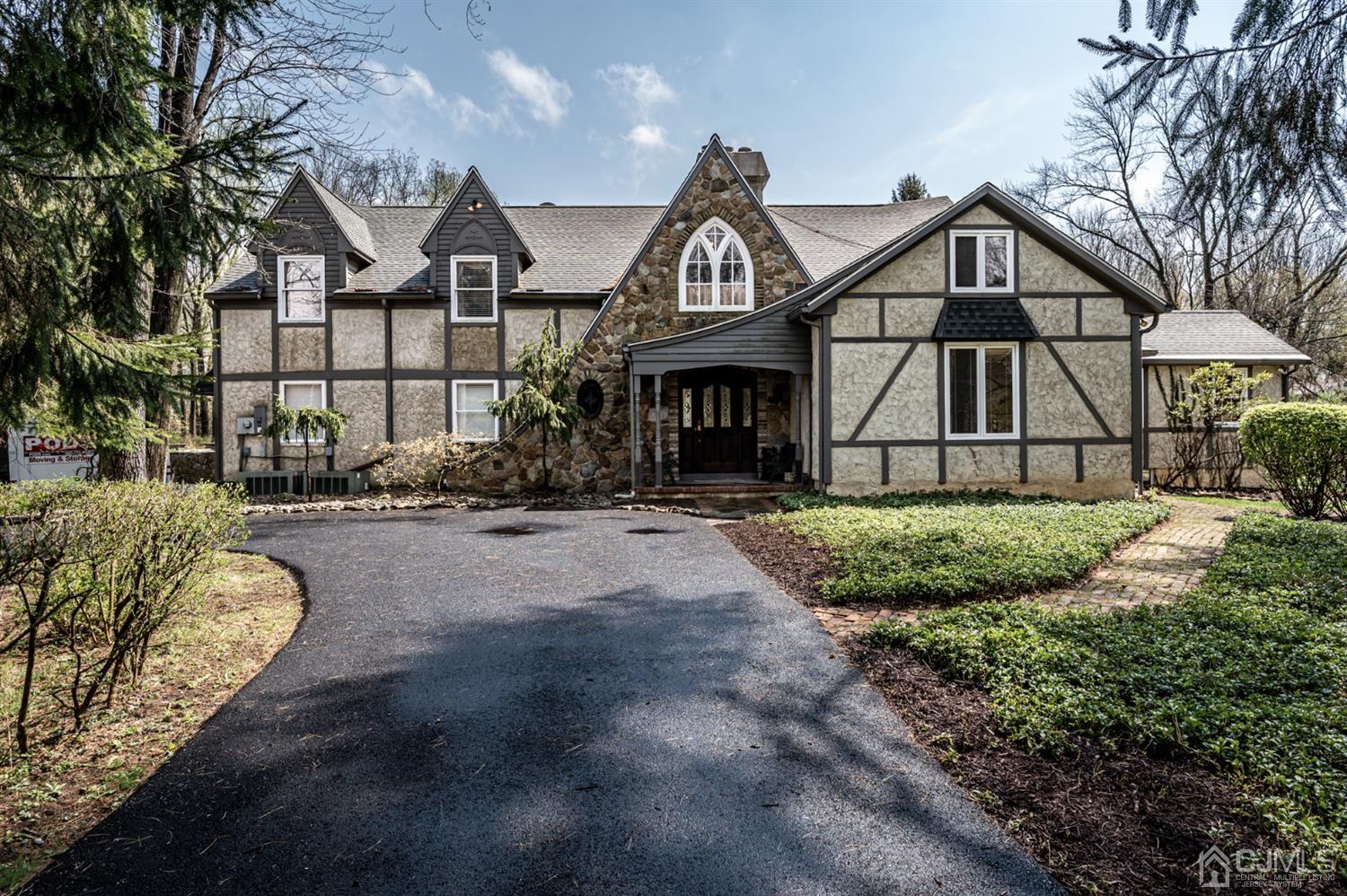 a front view of a house with a yard and outdoor space