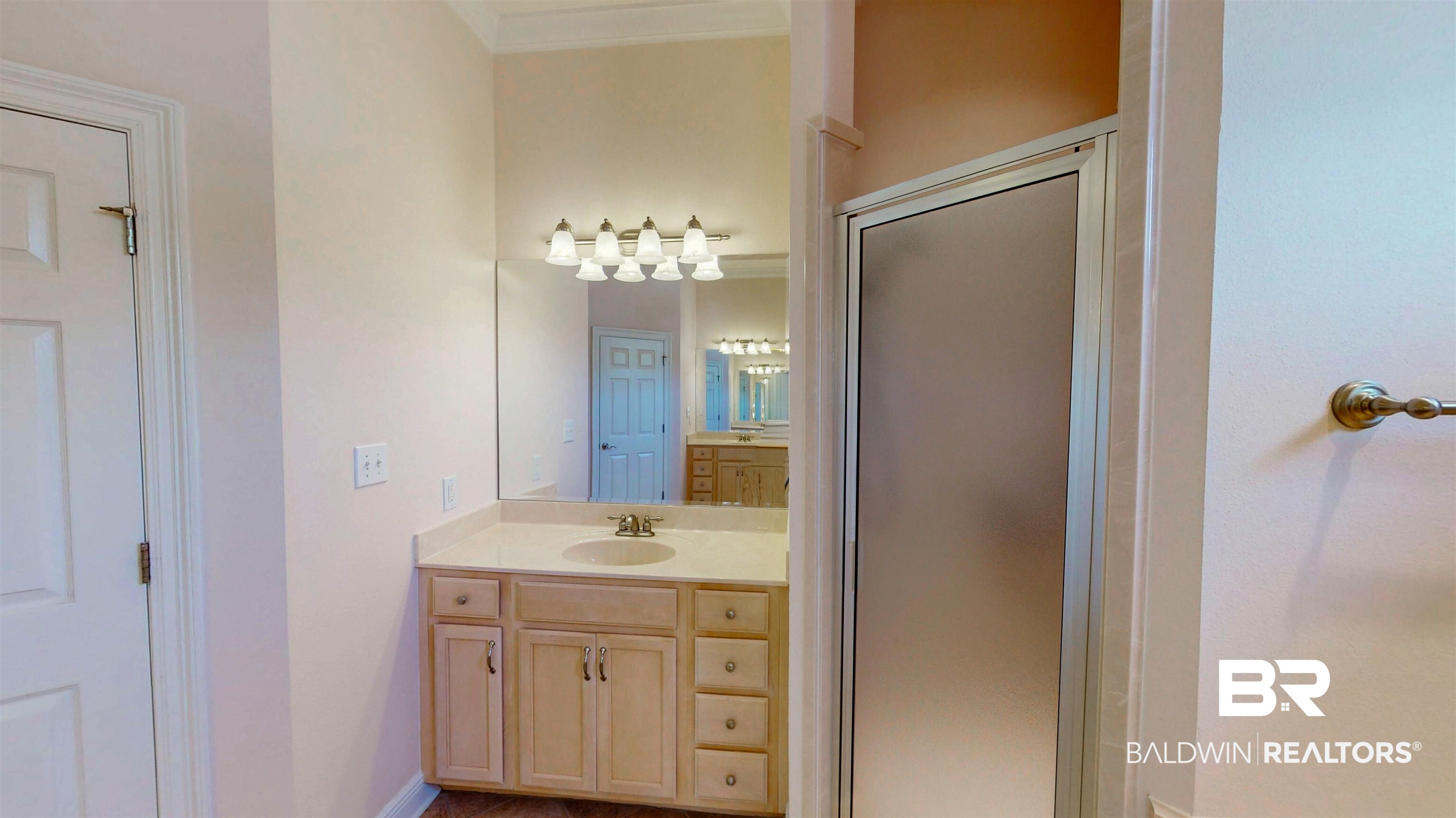 214 Hemingway Loop Foley, AL 36535 - Photo 28 of 67 Full bathroom featuring vanity, a stall shower, and ornamental molding