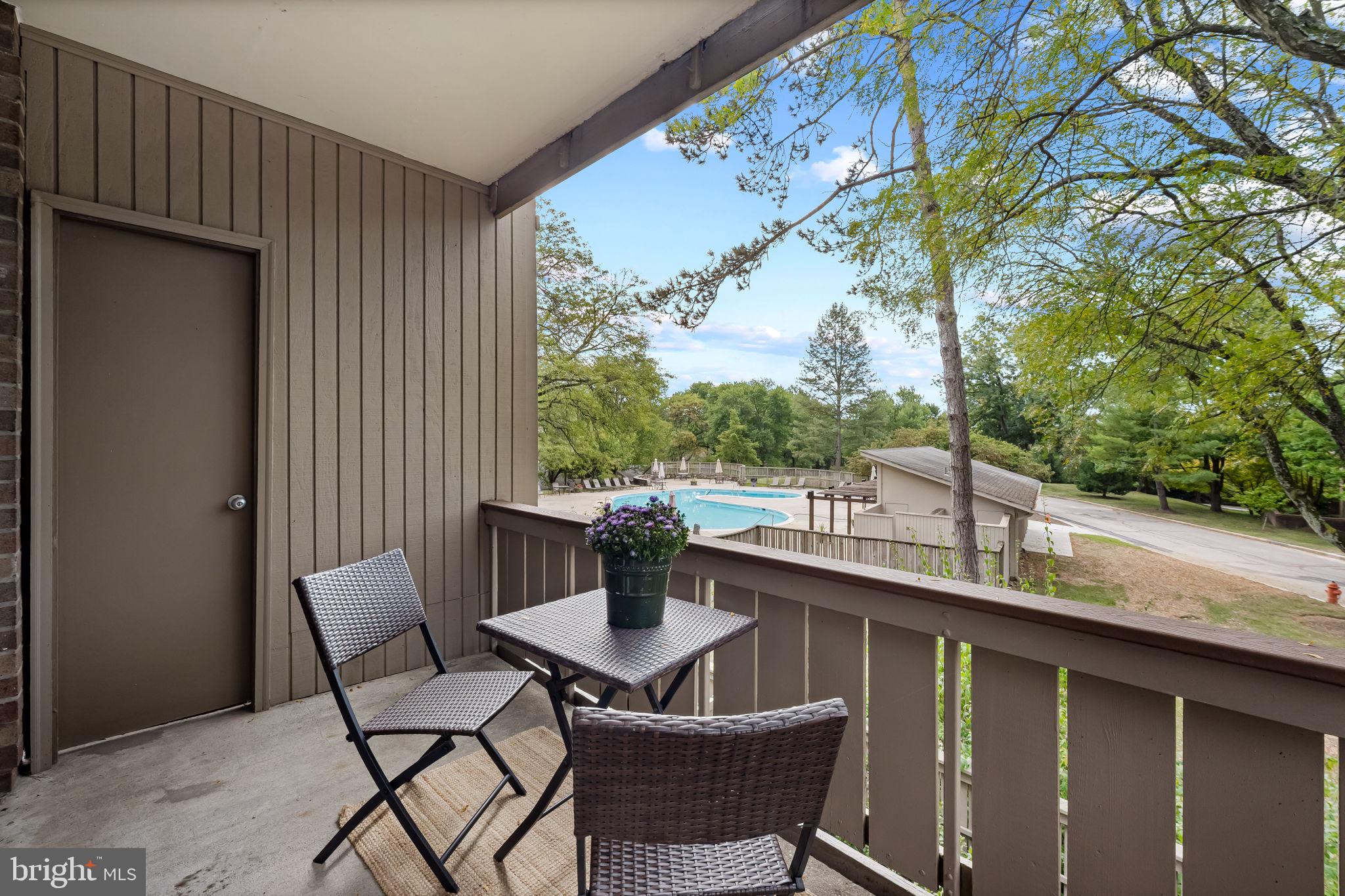 121 Cross Keys Road, Unit R121D Baltimore, MD 21210 - Photo 23 of 36 balcony with view of pool