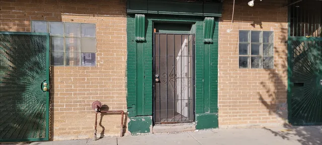 a view of a brick house with a large windows