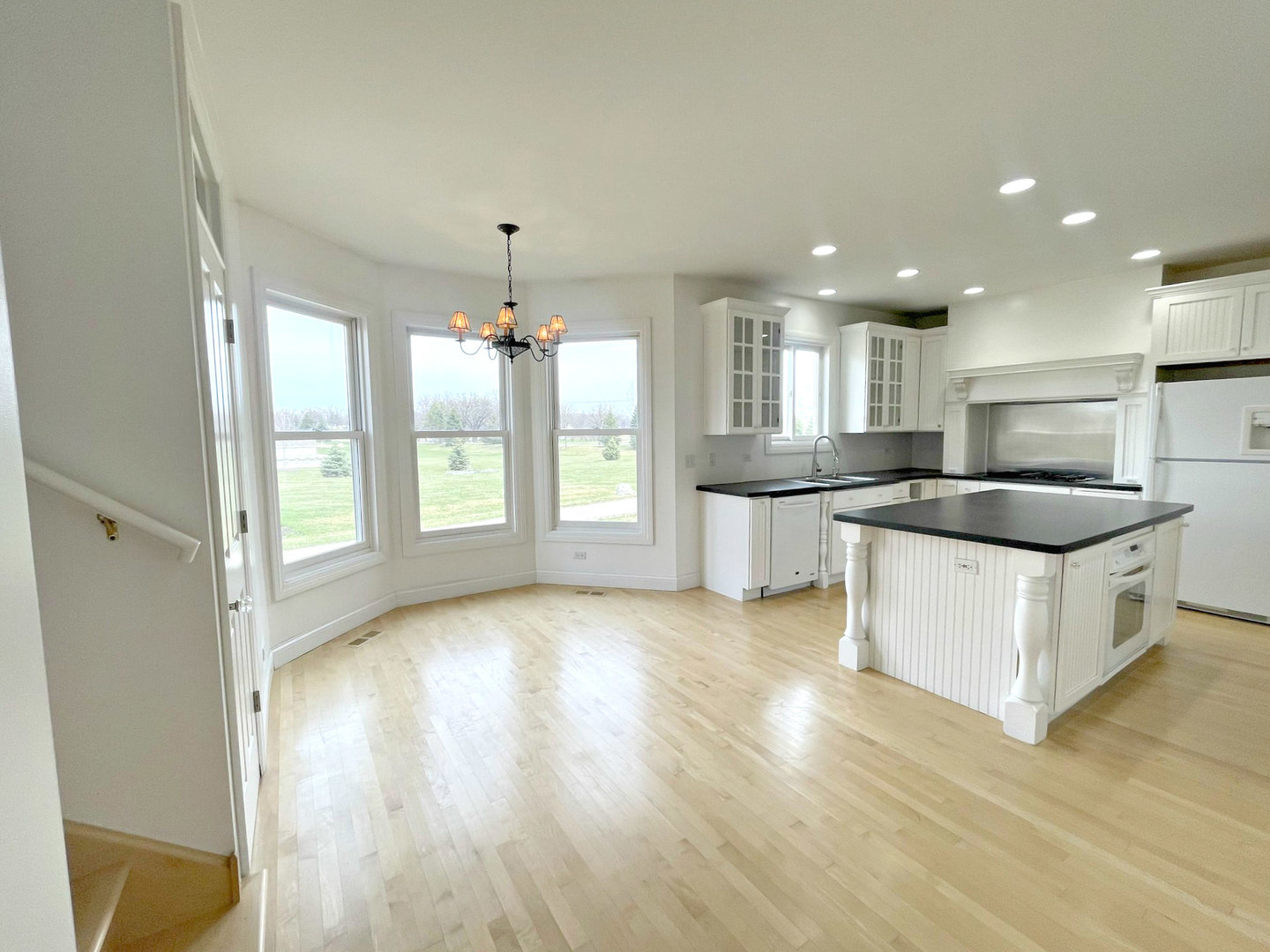 8208 Eagle Ridge Spring Grove, IL 60081 - Photo 11 of 39 a kitchen with stainless steel appliances granite countertop a refrigerator a sink and a stove