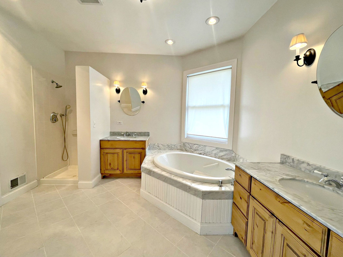 8208 Eagle Ridge Spring Grove, IL 60081 - Photo 21 of 39 a spacious bathroom with a granite countertop tub sink and mirror