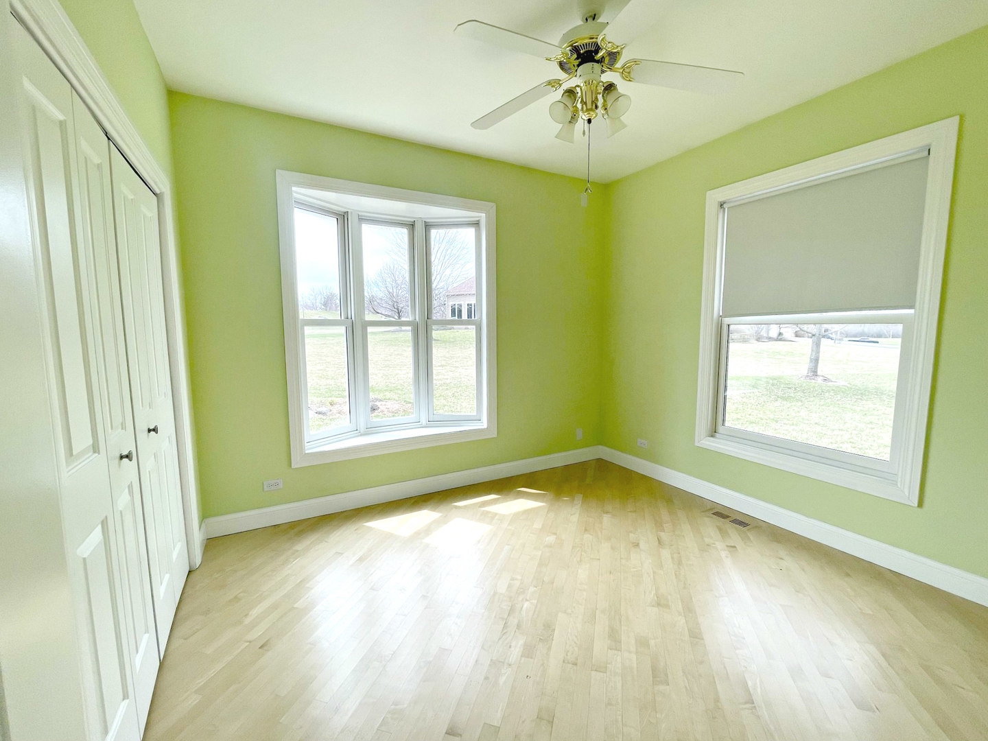 8208 Eagle Ridge Spring Grove, IL 60081 - Photo 26 of 39 a view of an empty room with a window and wooden floor
