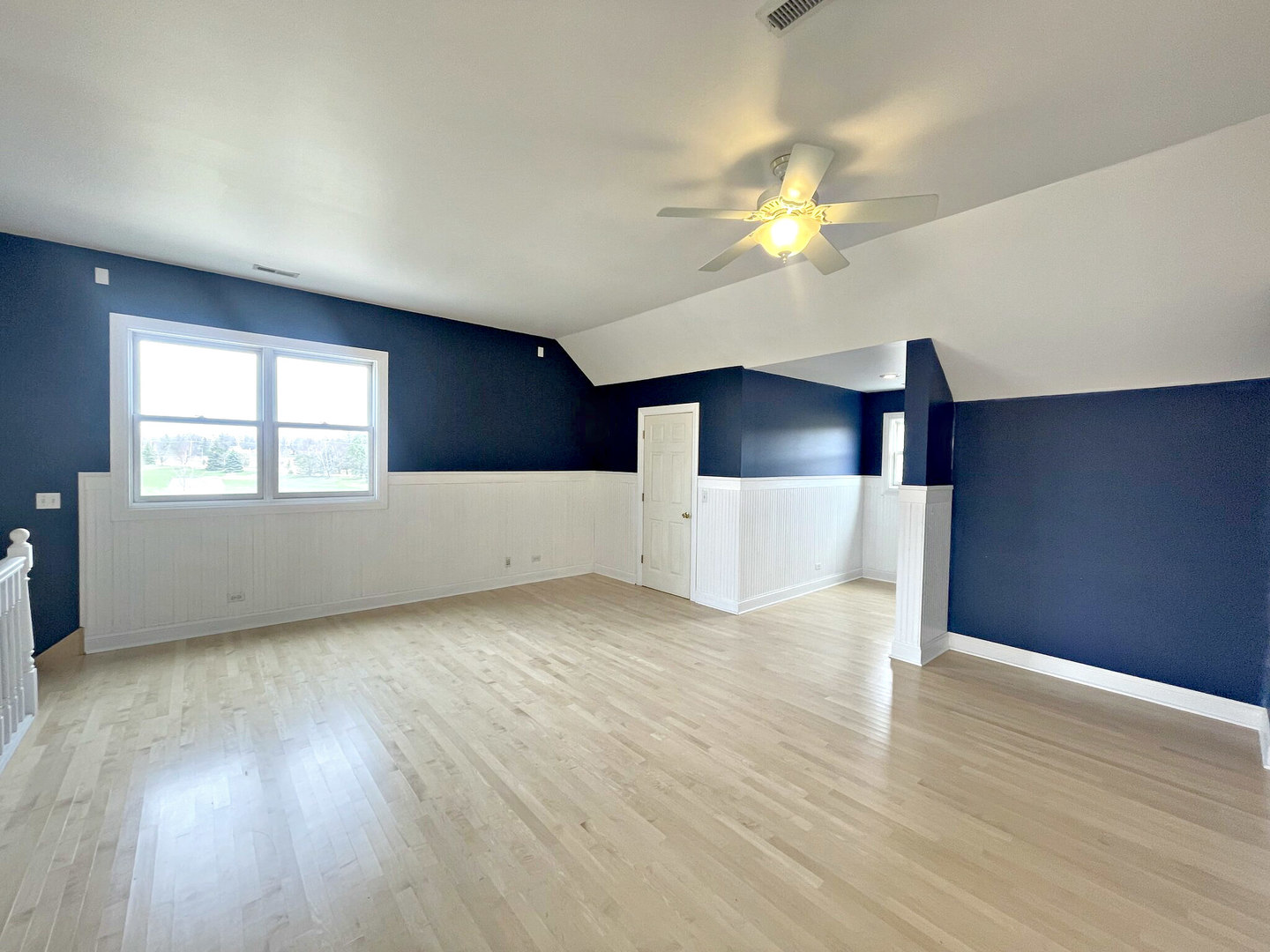 8208 Eagle Ridge Spring Grove, IL 60081 - Photo 30 of 39 a view of empty room with wooden floor and fan