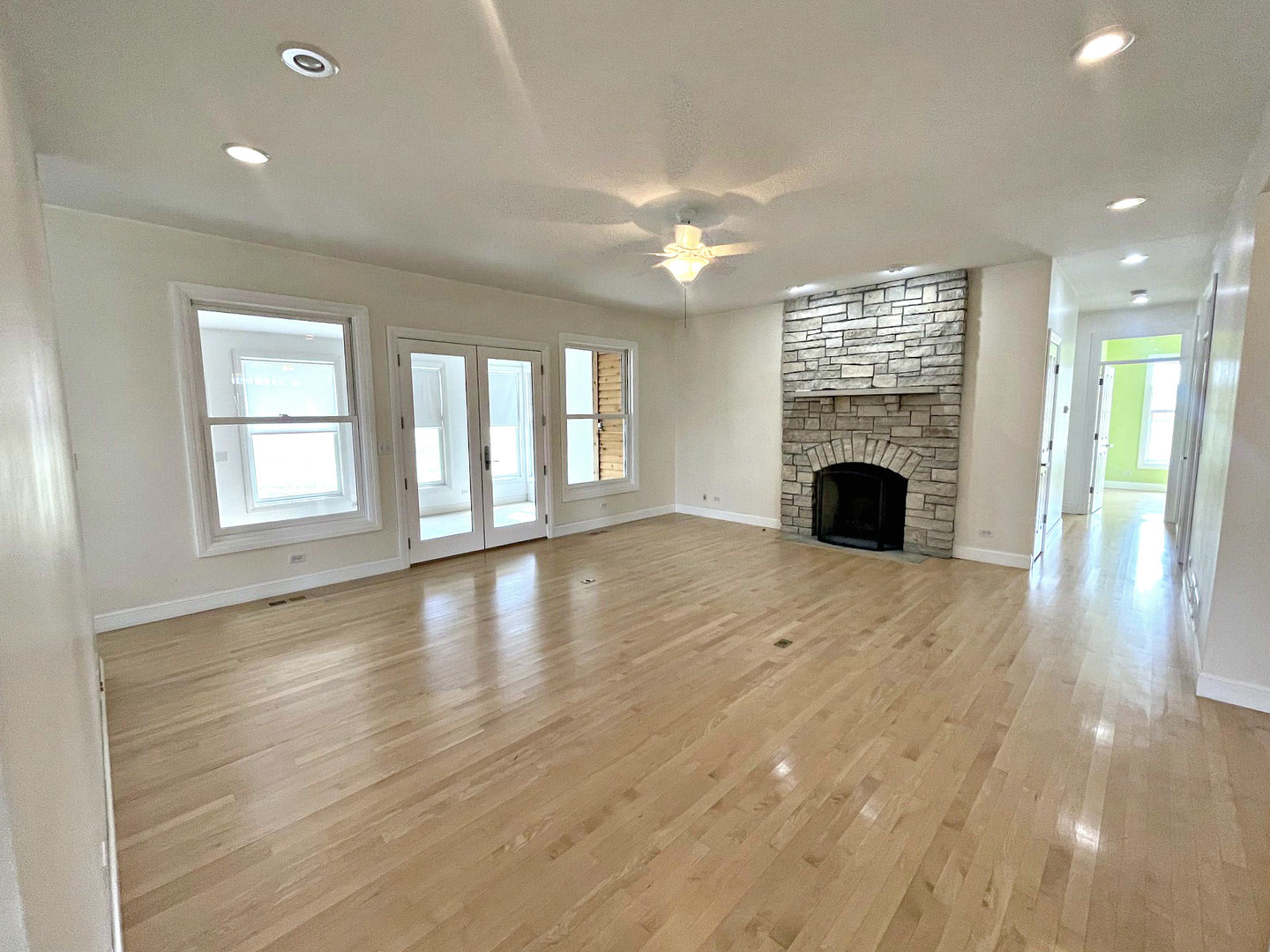 8208 Eagle Ridge Spring Grove, IL 60081 - Photo 5 of 39 a view of an empty room with window and wooden floor