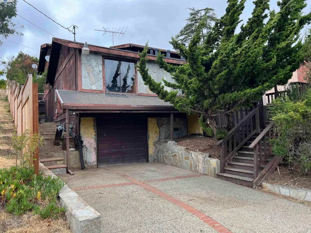 a front view of a house with a garage