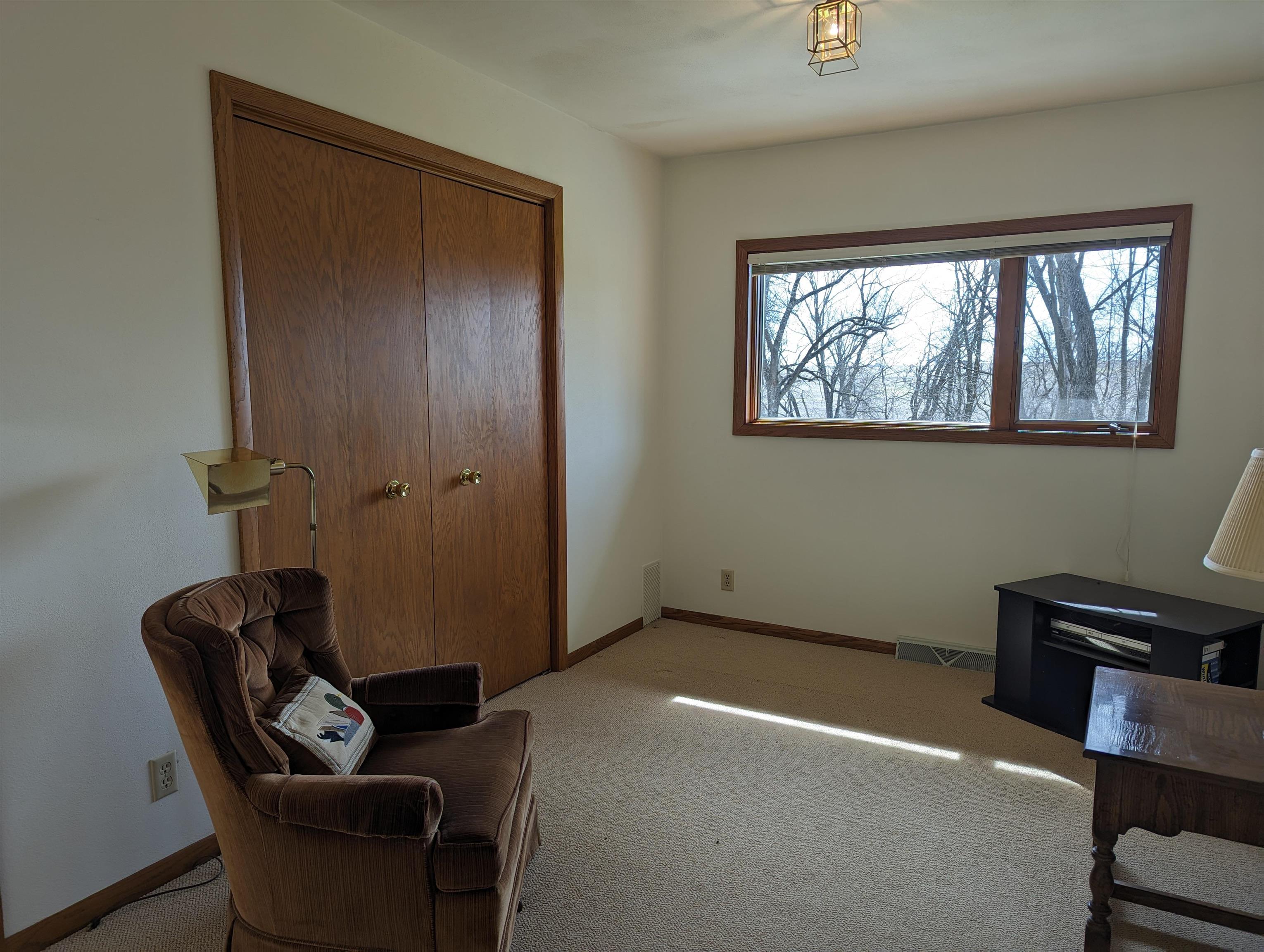 2995 West Forest Road Freeport, IL 61032 - Photo 24 of 42 a room with a chair and a window