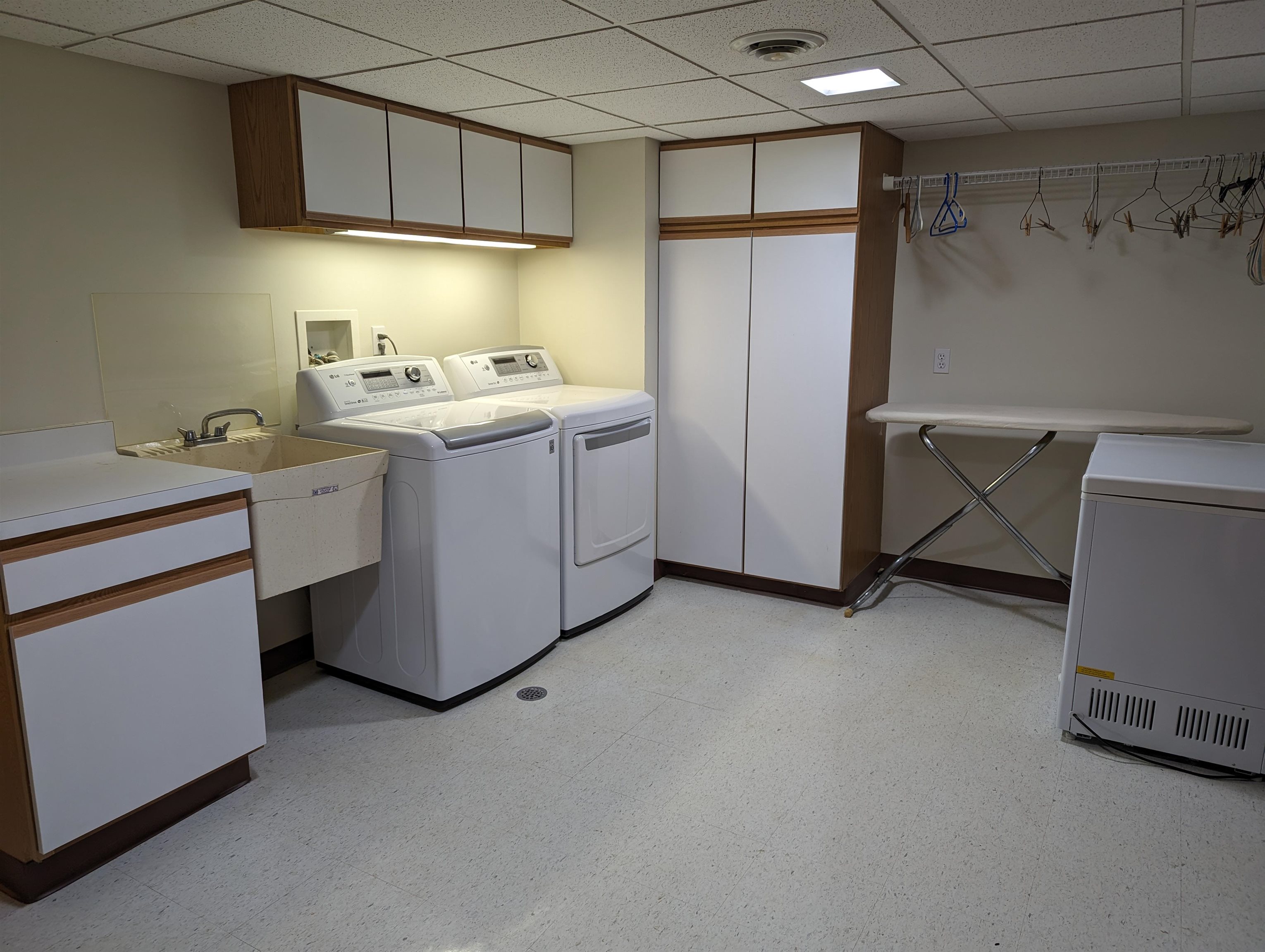 2995 West Forest Road Freeport, IL 61032 - Photo 36 of 42 a utility room with cabinets washer and dryer