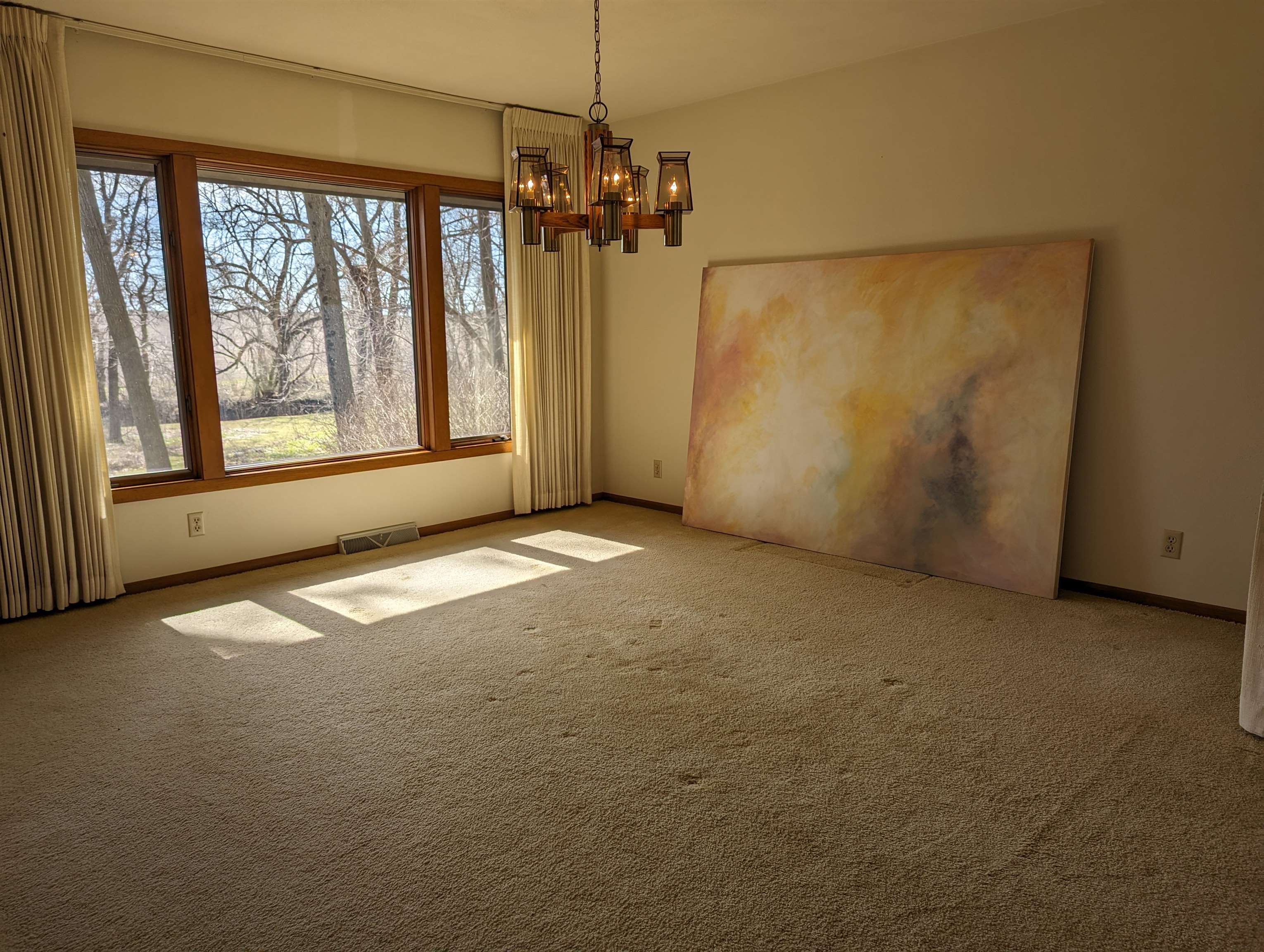 2995 West Forest Road Freeport, IL 61032 - Photo 4 of 42 an empty room with windows and chandelier