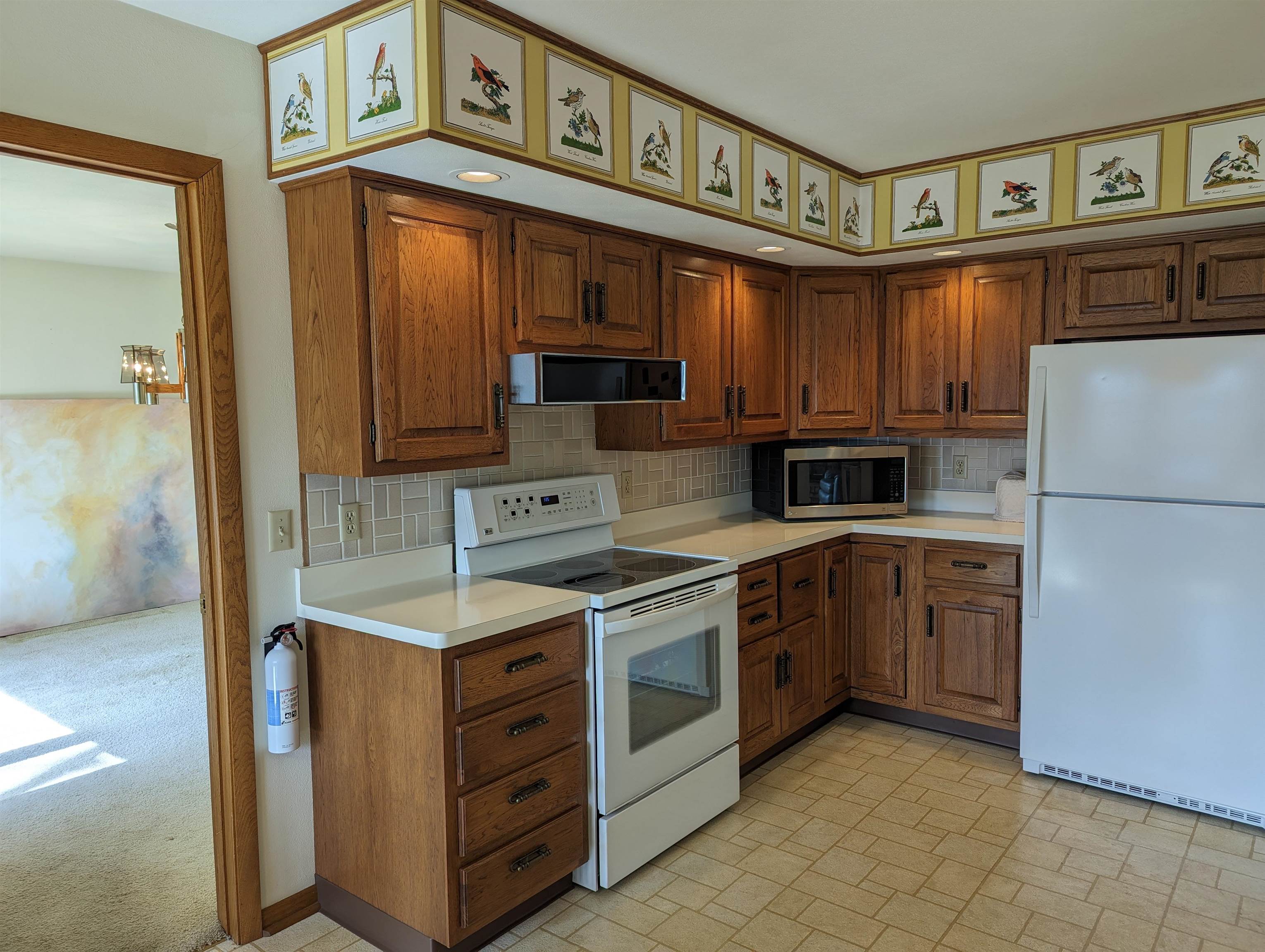 2995 West Forest Road Freeport, IL 61032 - Photo 5 of 42 a kitchen with stainless steel appliances granite countertop a refrigerator and a stove top oven