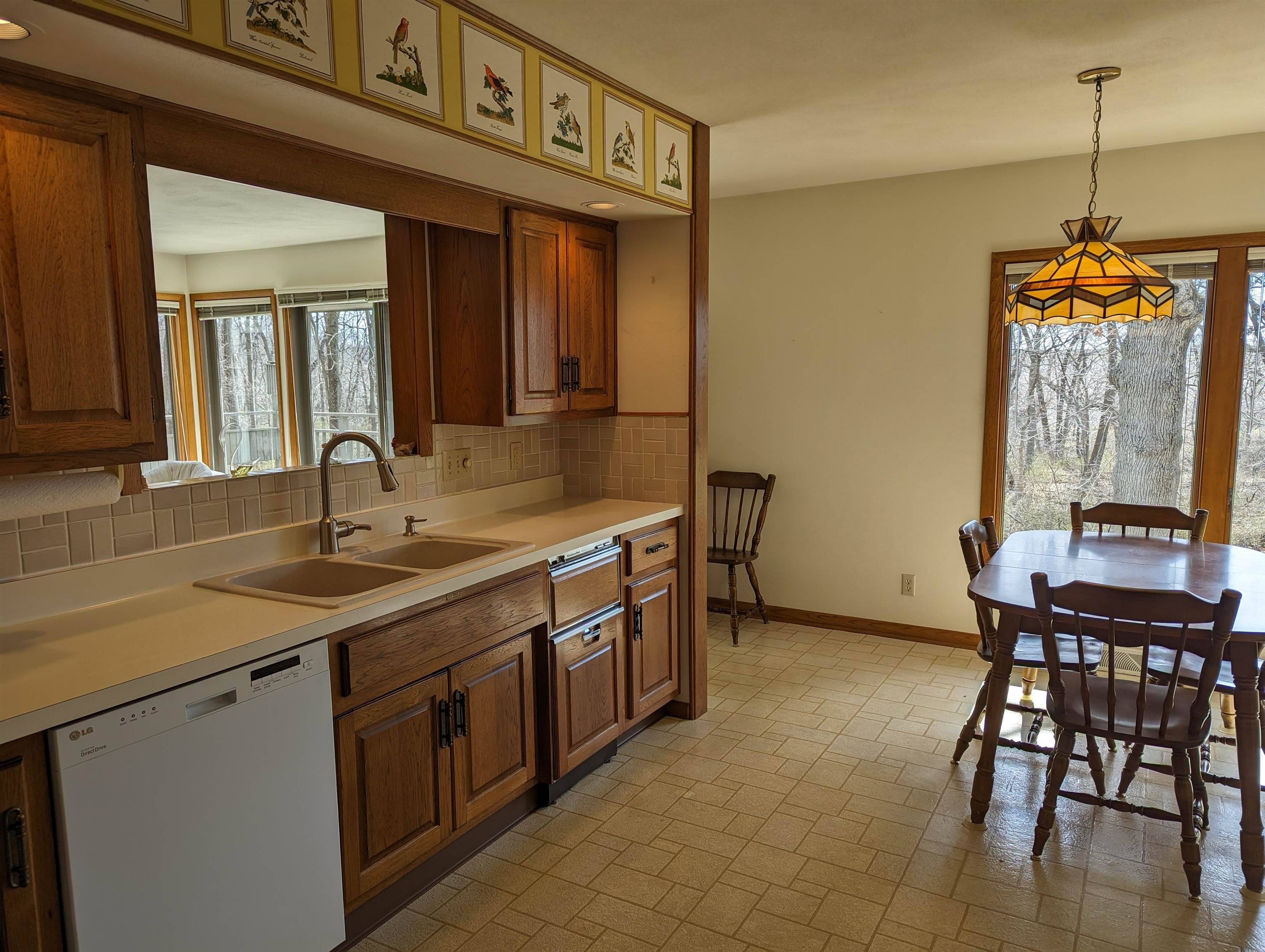 2995 West Forest Road Freeport, IL 61032 - Photo 7 of 42 a kitchen with a sink and chairs