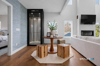 2 Old South Cove Road Old Saybrook, CT 06475 - Photo 16 of 40 AI Generated Photo - Elevator in is for depictional purposes only and is not included in the sale of the home. The home is prepped for a shaft-less elevator. Please speak with Listing Agent for details.