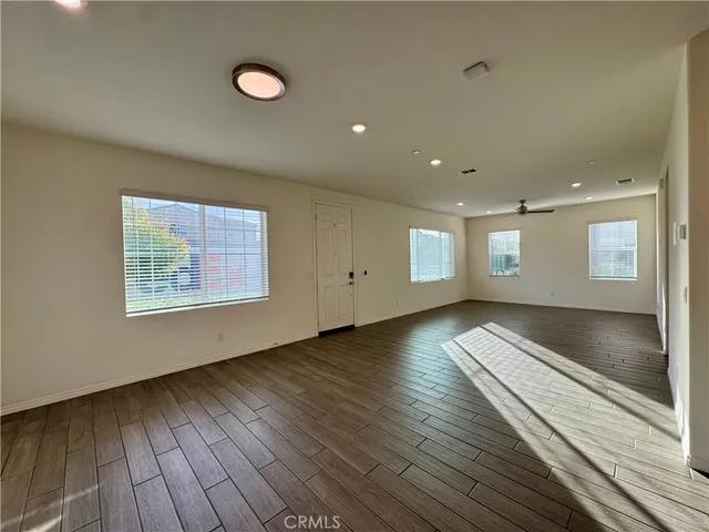 a view of a hallway with wooden shelves