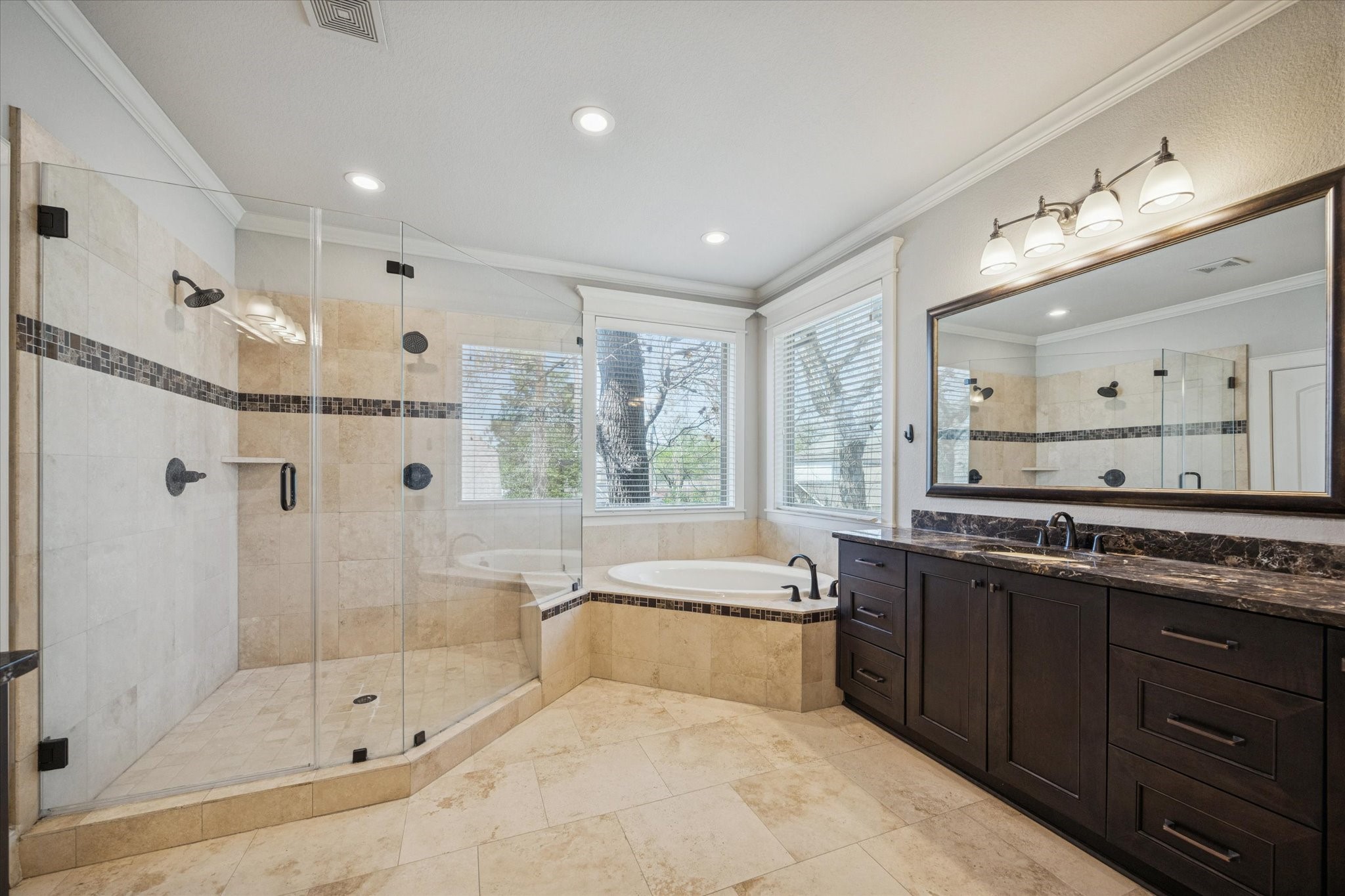1802 Wakefield Drive Houston, TX 77018 - Photo 27 of 47 The primary ensuite features an oversized walk in shower and bath tub.
