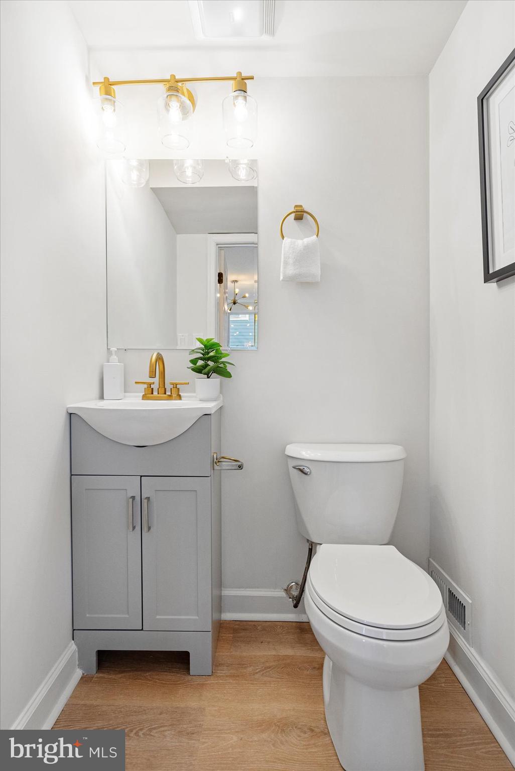 7803 Brevort Road Windsor Mill, MD 21244 - Photo 21 of 45 a bathroom with a sink a toilet and mirror
